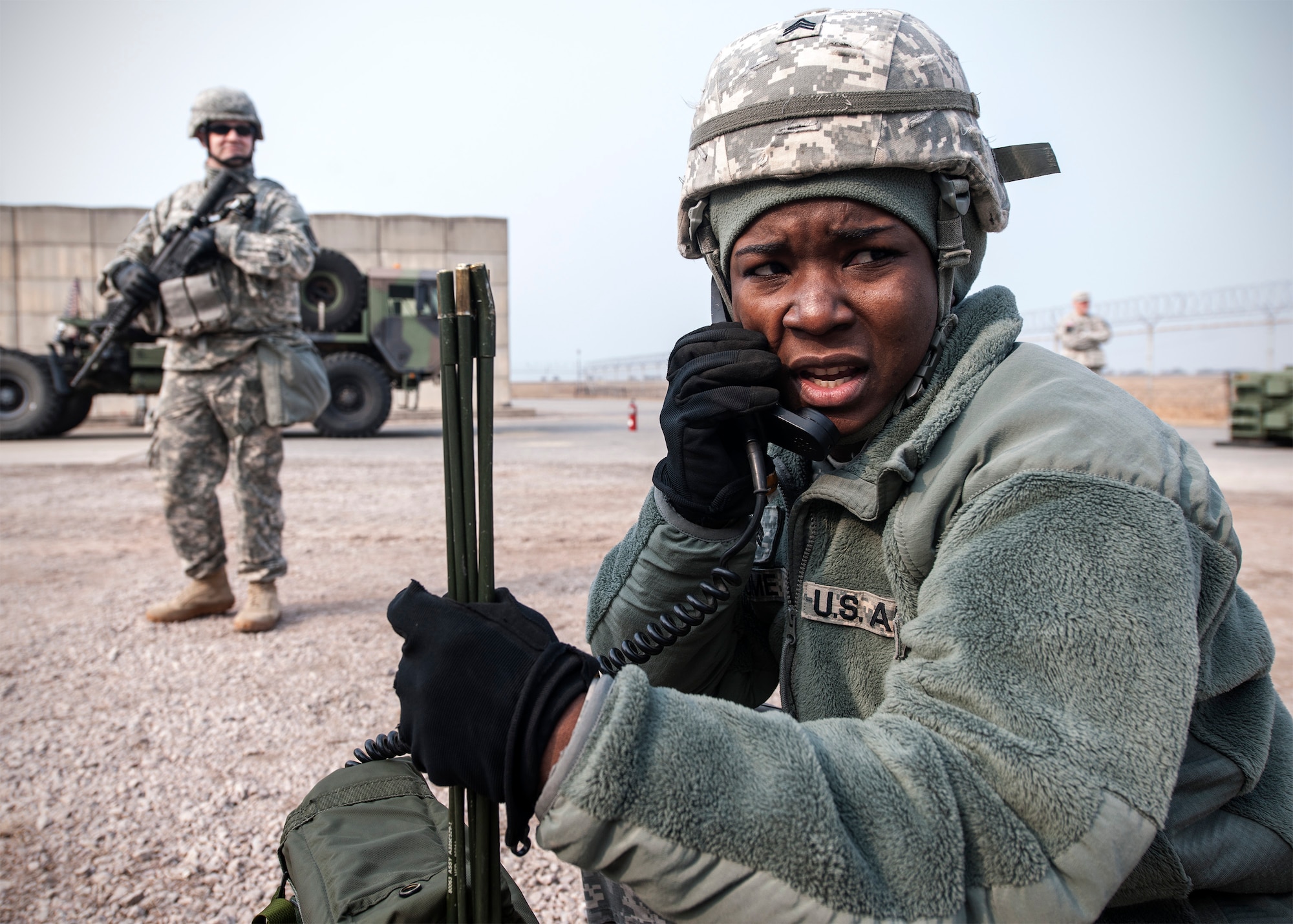 Sergeant Stephanie Hume, Alpha Battery, 2nd Battalion, 1st Air Defense Artillery patriot missile maintainer, calls the command post after receiving a dropped missile canister inject during a quarterly field training exercise at Kunsan Air Base, Republic of Korea, Feb. 11, 2015. Although patriot missile maintainers complete semiannual reload evaluations, simulating a canister drop was a surprise inject during the FTX. (U.S. Air Force photo by Senior Airman Katrina Heikkinen/Released)

