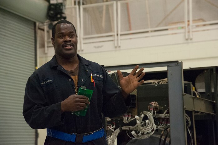 JOINT BASE CHARLESTON, S.C. – Paul Mansfield, 437th Maintenance Squadron Aerospace Ground Equipment technician, briefs community leaders about his role in maintaining an ESSEX Generator at Joint Base Charleston, S.C., Feb. 11, 2015. The tour exposed the leaders to the important contributions of Charleston’s Nighttime Warriors. Mansfield, a former service member, has filled a civilian position at Joint Base Charleston since 1986 and has worked night shift since 2007. (U.S. Air Force Photo/Capt. Christopher Love)
