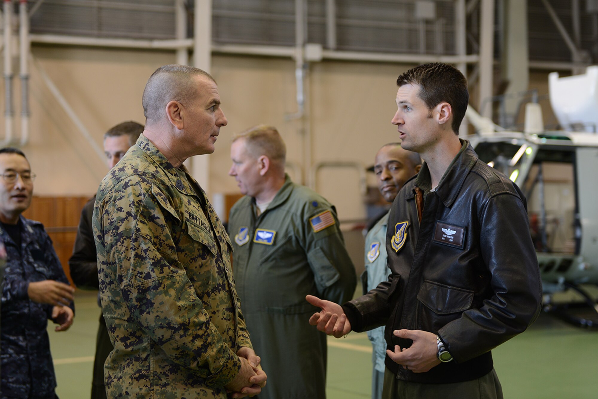 Maj. Brian MacLean, 459th Airlift Squadron, explains the airlift capabilities of the squadron to Marine Corps Sgt. Maj. Bryan Battaglia, the senior enlisted advisor to the chairman of the Joint Chiefs of Staff, at Yokota Air Base, Japan, Feb. 11, 2015. The 459 AS operates UH-1N Huey’s and C-12 Huron’s to accomplish its missions. (U.S. Air Force photo by Senior Airman Desiree Economides/Released)