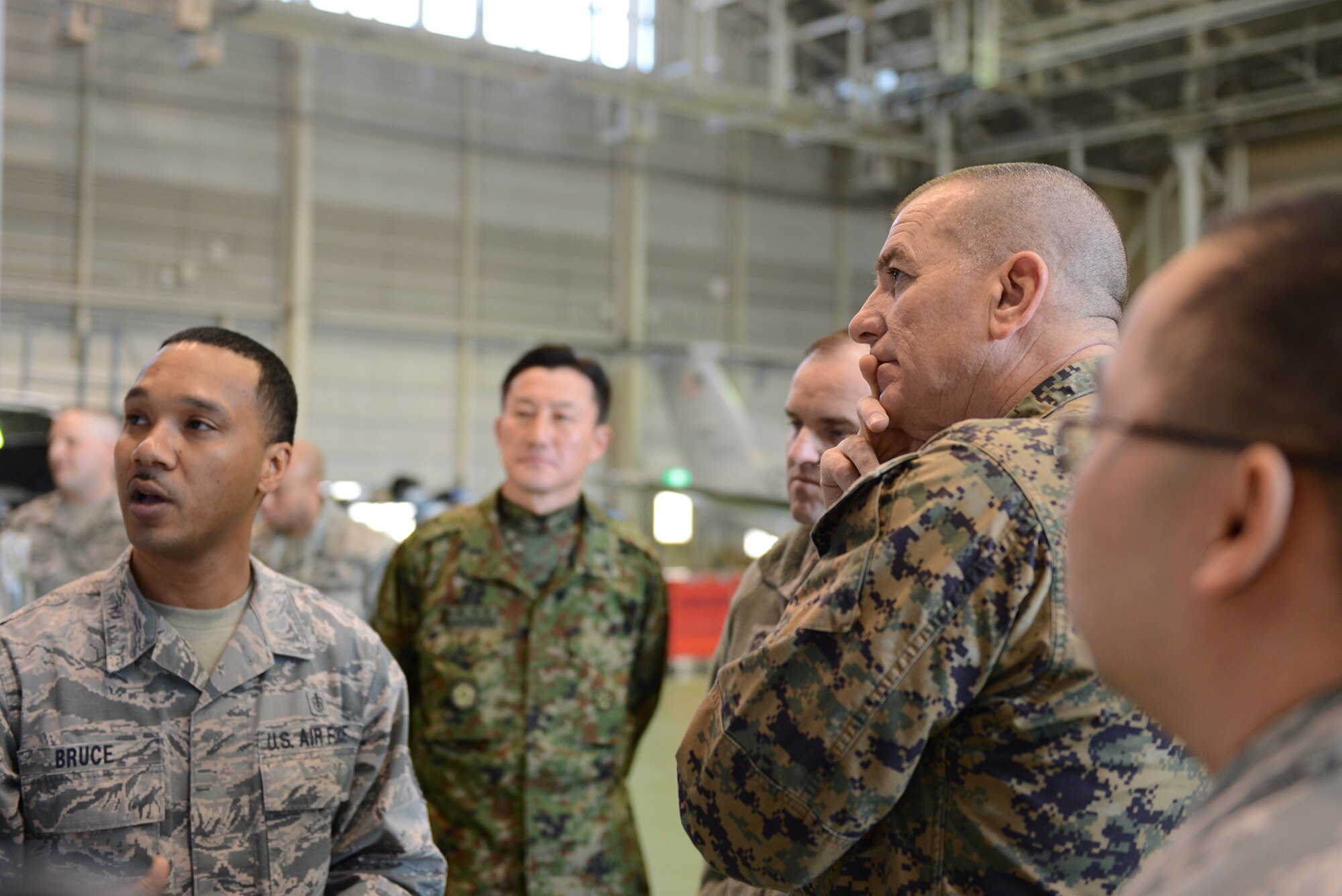 Marine Corps Sgt. Maj. Bryan Battaglia, the senior enlisted advisor to the chairman of the Joint Chiefs of Staff, listens to a briefing about medical logistics from Tech. Sgt. Kristoffer Bruce, 374th Medical Surgical Squadron, Feb. 11, 2015, at Yokota Air Base, Japan. While in the Far East, Battaglia visited military installations, such as Yokota, to learn about operations and challenges as the pivot to the Pacific continues. (U.S. Air Force photo by Senior Airman Desiree Economides/Released)