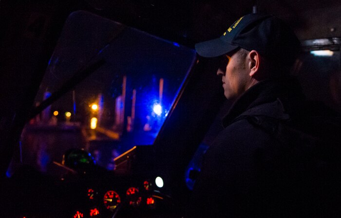 Master at Arms 2nd Class Michael Harkey, 628th Security Force Squadron level two coxswain, docks a patrol boat Feb. 11, 2015, at Dock Charlie on Joint Base Charleston – Weapons Station, S.C. The night operation demonstrated the Defenders’ insertion and extraction capabilities, while increasing teamwork and camaraderie. (U.S. Air Force photo/Airman 1st Class Clayton Cupit)