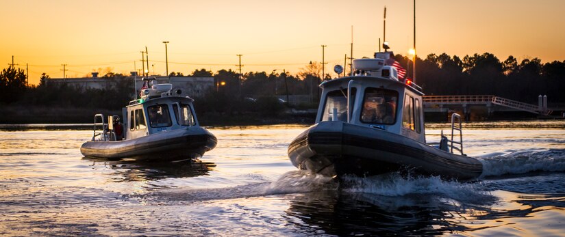 Two 628th Security Forces Squadron patrol boats drive in formation Feb. 11, 2015, at dock Charlie on Joint Base Charleston – Weapons Station, S.C. The night operation demonstrated the Defenders’ insertion and extraction capabilities, while increasing teamwork and camaraderie. (U.S. Air Force photo/Airman 1st Class Clayton Cupit)