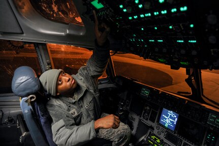 Tech. Sgt. Paul Lumpkin, an integrated communications countermeasure navigation system craftsman with the 437th Aircraft Maintenance Squadron, troubleshoots a radio fault reported during a post-flight briefing with crew members at Joint Base Charleston, S.C., Feb, 11, 2015. Lumpkin analyzes malfunctions as well as inspects, removes, maintains, and installs integrated avionics systems on the C-17 Globemaster III—all while working the mid shift. (U.S. Air Force photo/Tech. Sgt. Renae Pittman)