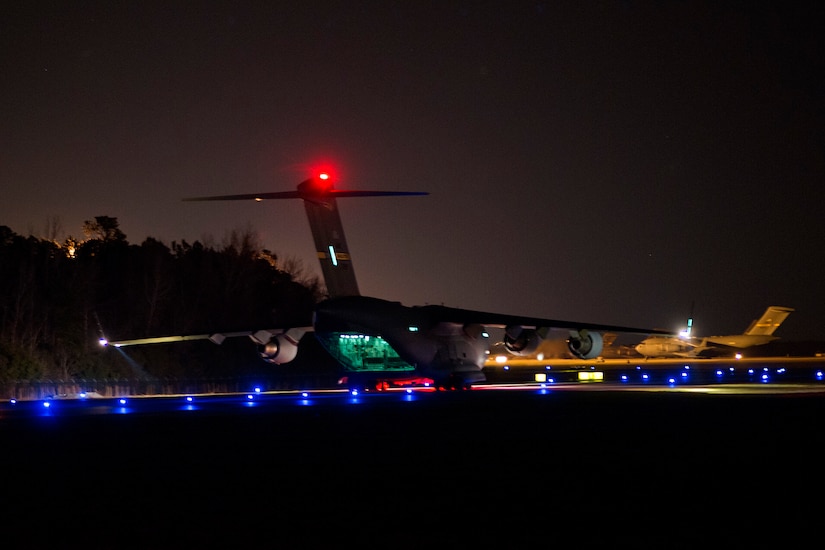 A C-17 Globemaster III, assigned to the 437th Airlift Wing, performsg combat drop training at Joint Base Charleston, S.C., Feb. 10, 2015. By training by day and night, crew members maintain proficiency on a full range of skills sets. (U.S. Air Force photo/Tech. Sgt. Renae Pittman)
