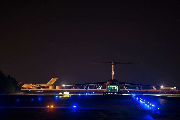 A C-17 Globemaster III, assigned to the 437th Airlift Wing, performsg combat drop training at Joint Base Charleston, S.C., Feb. 10, 2015. By training by day and night, crew members maintain proficiency on a full range of skills sets. (U.S. Air Force photo/Tech. Sgt. Renae Pittman)