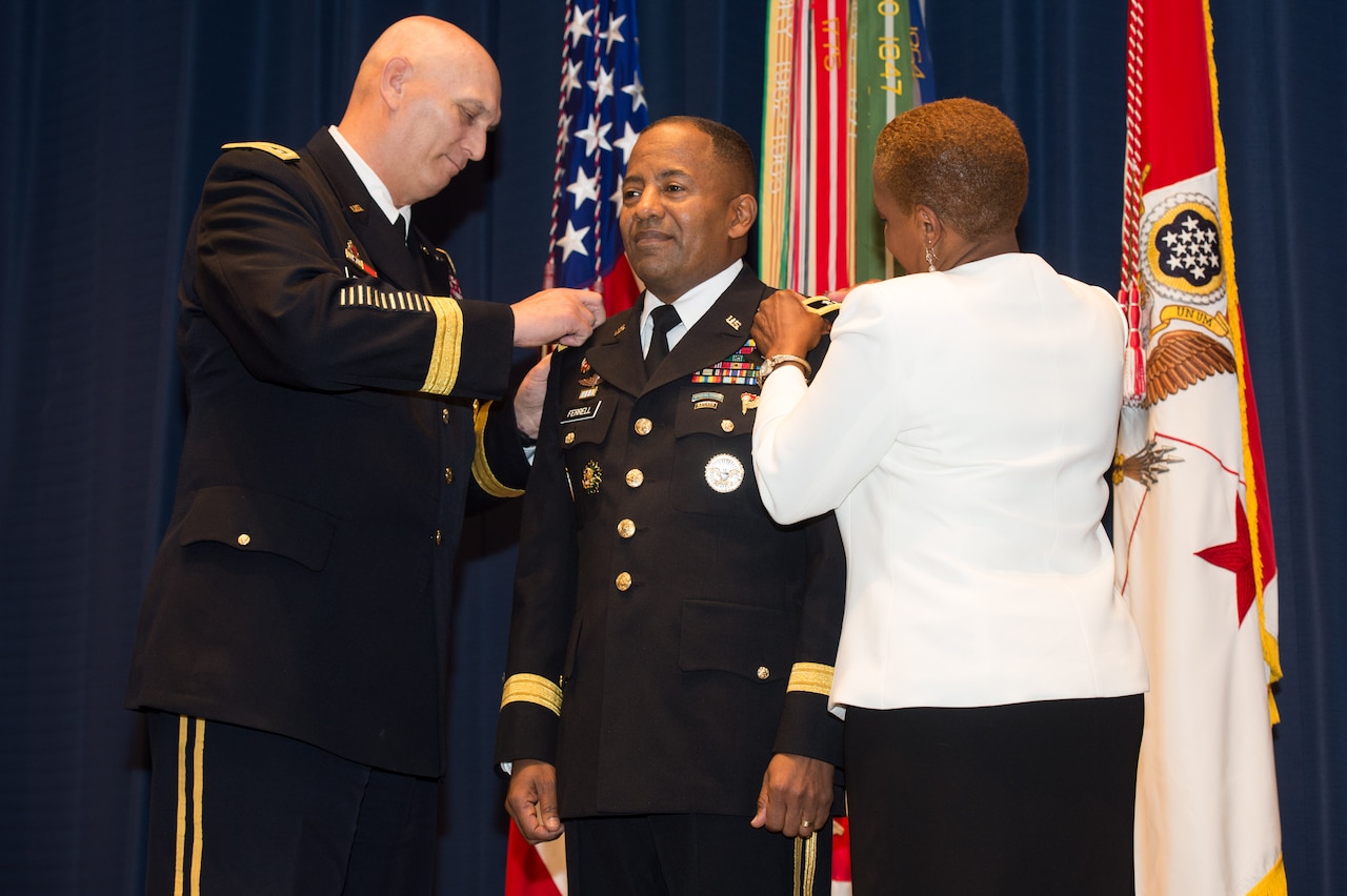 Army Chief of Staff Gen. Ray Odierno and Monique Ferrell pin three-star rank on Army Lt. Gen. Robert S. Ferrell during a Jan. 24, 2014, promotion ceremony at Fort Lesley J. McNair in Washington, D.C. U.S. Army photo by Staff Sgt. Steve Cortez