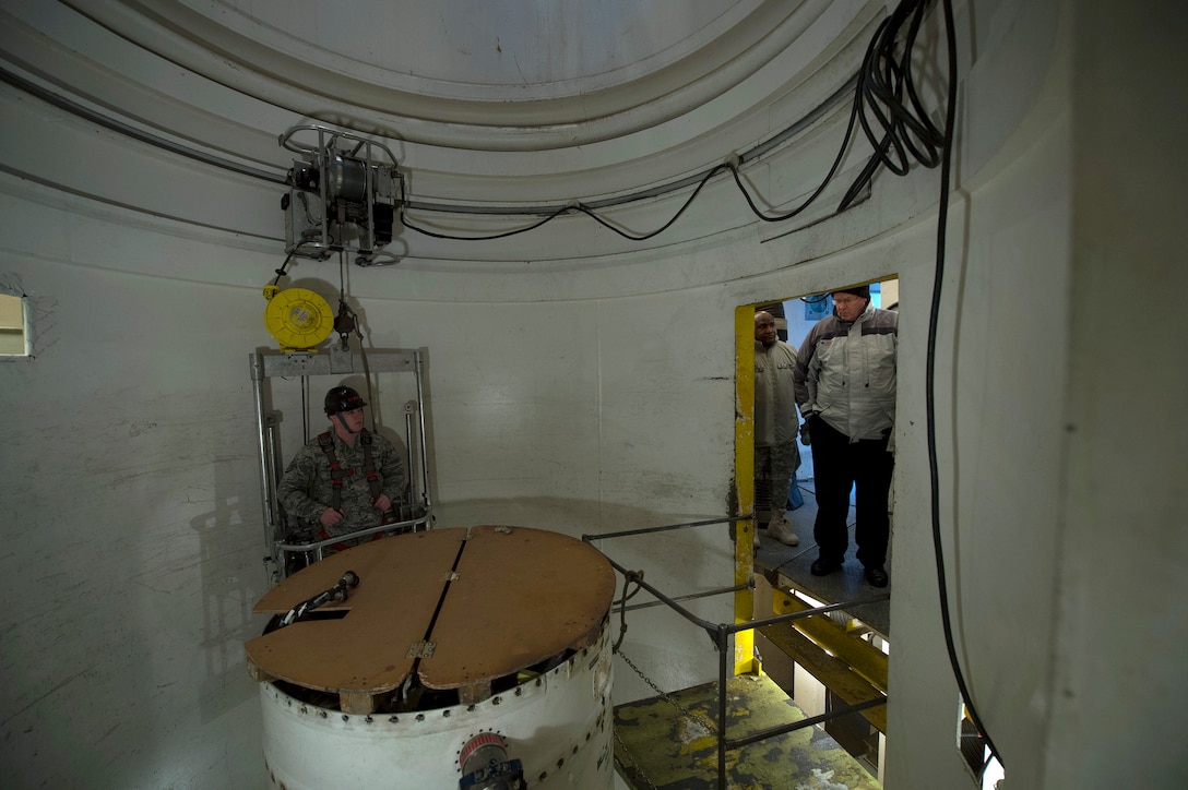 Deputy Defense Secretary Bob Work tours a missile silo maintenance training facility as he visits the base to meet with nuclear enterprise airmen on Minot Air Force Base, N.D., Feb. 11, 2015. 