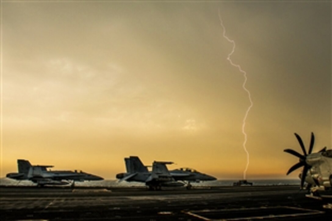 Lightning flashes over the flight deck of the aircraft carrier USS Carl Vinson as the ship transits the Persian Gulf, Feb. 8, 2015. The carrier is deployed in the U.S. 5th Fleet area of responsibility supporting Operation Inherent Resolve.
