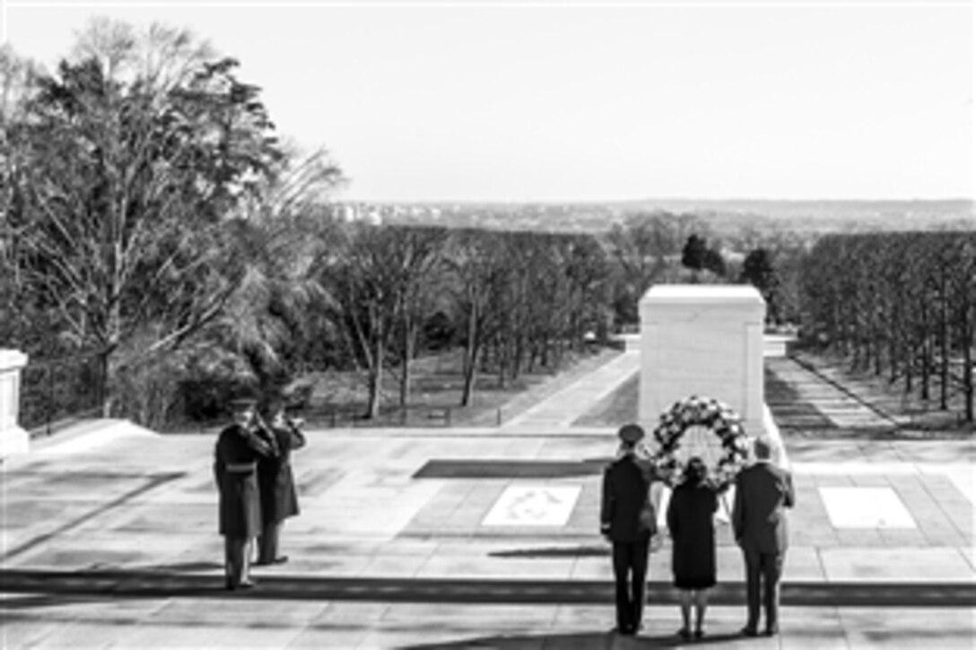 During his last week in office, Defense Secretary Chuck Hagel, far right, visited the Tomb of the Unknown Soldier at Arlington National Cemetery in Arlington, Va., Feb. 11, 2015. 