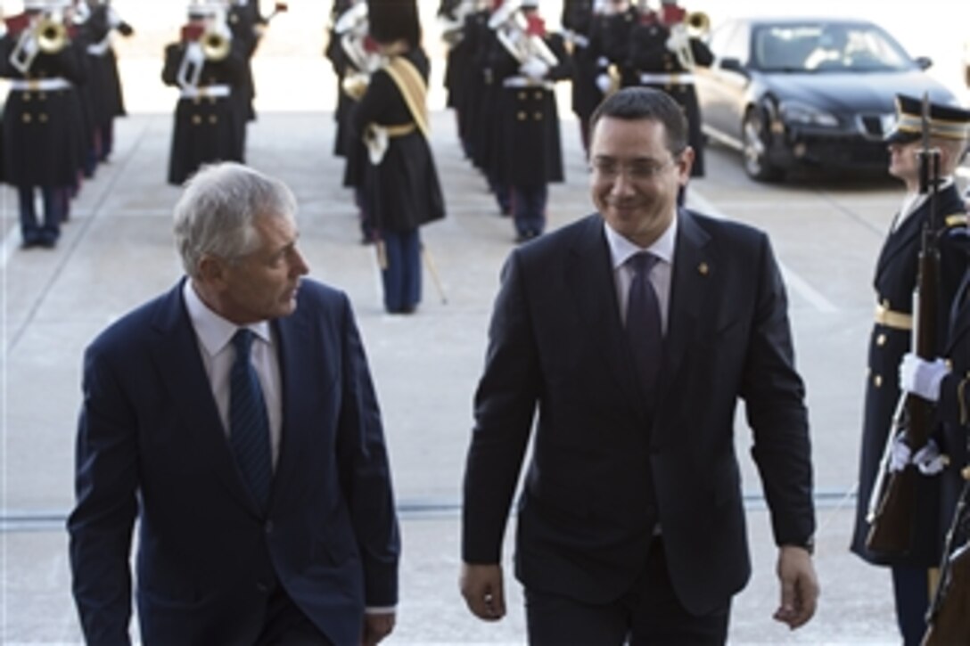 Defense Secretary Chuck Hagel hosts an enhanced honor cordon for Romanian Prime Minister Victor Ponta upon his arrival at the Pentagon for meetings, Feb. 11, 2015. 