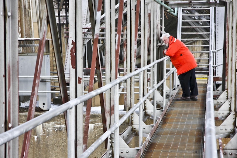 Rich Lockwood, Operations and Regulatory Division chief, looks down on deteriorated lift gates from a catwalk along the Montgomery Locks and dam. 