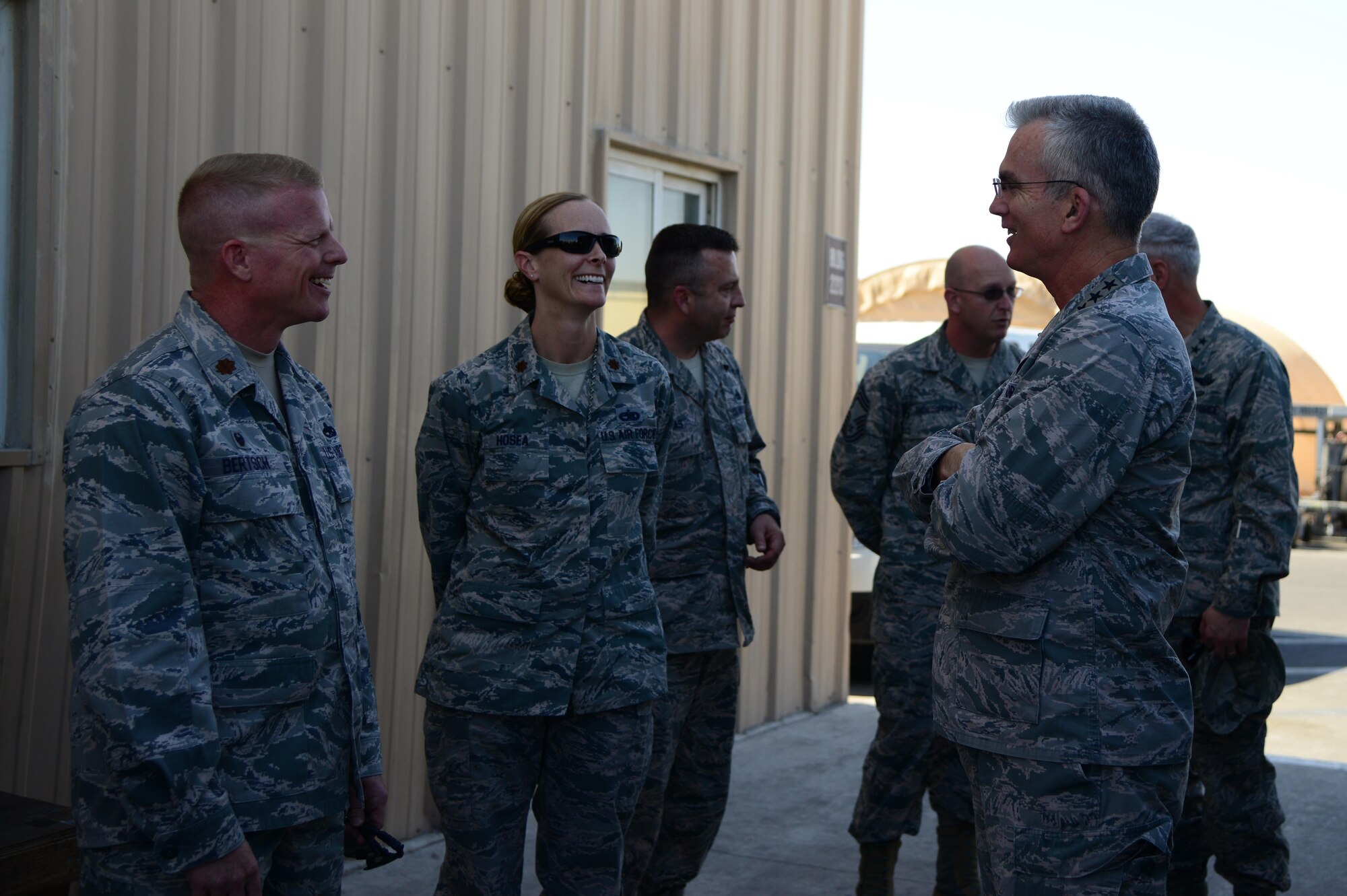 U.S. Air Force Gen. Paul Selva, right, commander of U.S. Transportation Command, talks to Maj. Jay Bertsch, 379th Expeditionary Aircraft Maintenance Squadron commander, and Maj. Mary Hosea, 340th Expeditionary Aircraft Maintenance Unit, during his visit, Jan. 31, 2015, at Al Udeid Air Base, Qatar. USTRANSCOM is the single manager of global air, land and sea transportation for the Department of Defense. (U.S. Air Force Senior Airman Kia Atkins)