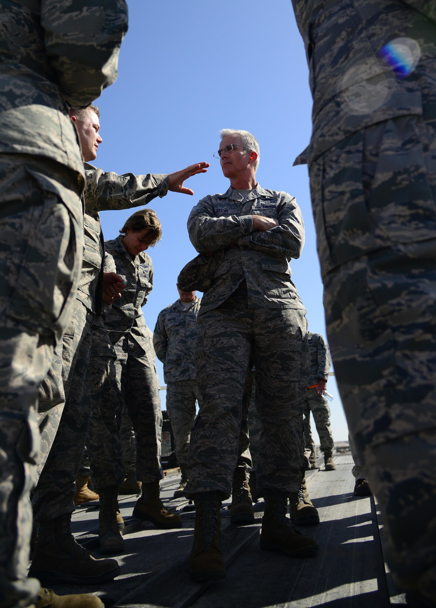 U.S. Air Force Gen. Paul Selva, center, commander of U.S. Transportation Command, interacts with Airmen during his visit, Jan. 31, 2015, at Al Udeid Air Base, Qatar. USTRANSCOM is the single manager of global air, land and sea transportation for the Department of Defense.  (U.S. Air Force photo by Senior Airman Kia Atkins)