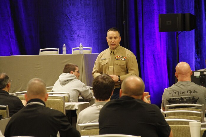 Major Alfred L. Butler, IV, Marine Corps Recruiting Station Kansas City commanding officer, addresses coaches on ways to instill leadership during the 2015 Glazier Clinics at the Westin Crown Center Feb. 6, 2015. Butler related how his experiences as an infantry officer and leading Marines and how many of the same principles he employed may help to foster teamwork and leadership amongst coaches' players. 