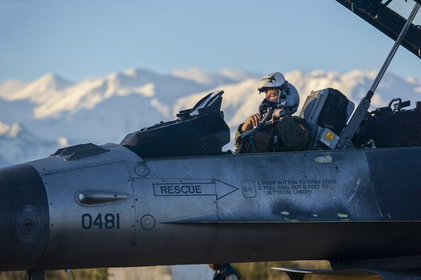 An F-16 Fighting Falcon fighter aircraft pilot assigned to the 480th Expeditionary Fighter Squadron fastens his breathing mask onto his helmet Jan. 30, 2015, during a flying training deployment at Souda Bay, Greece. The aircraft conducted the training as part of the bilateral deployment between the Greek and U.S. air forces to develop interoperability and cohesion between the two NATO partners. (U.S. Air Force photo/Staff Sgt. Joe W. McFadden)                                                                            