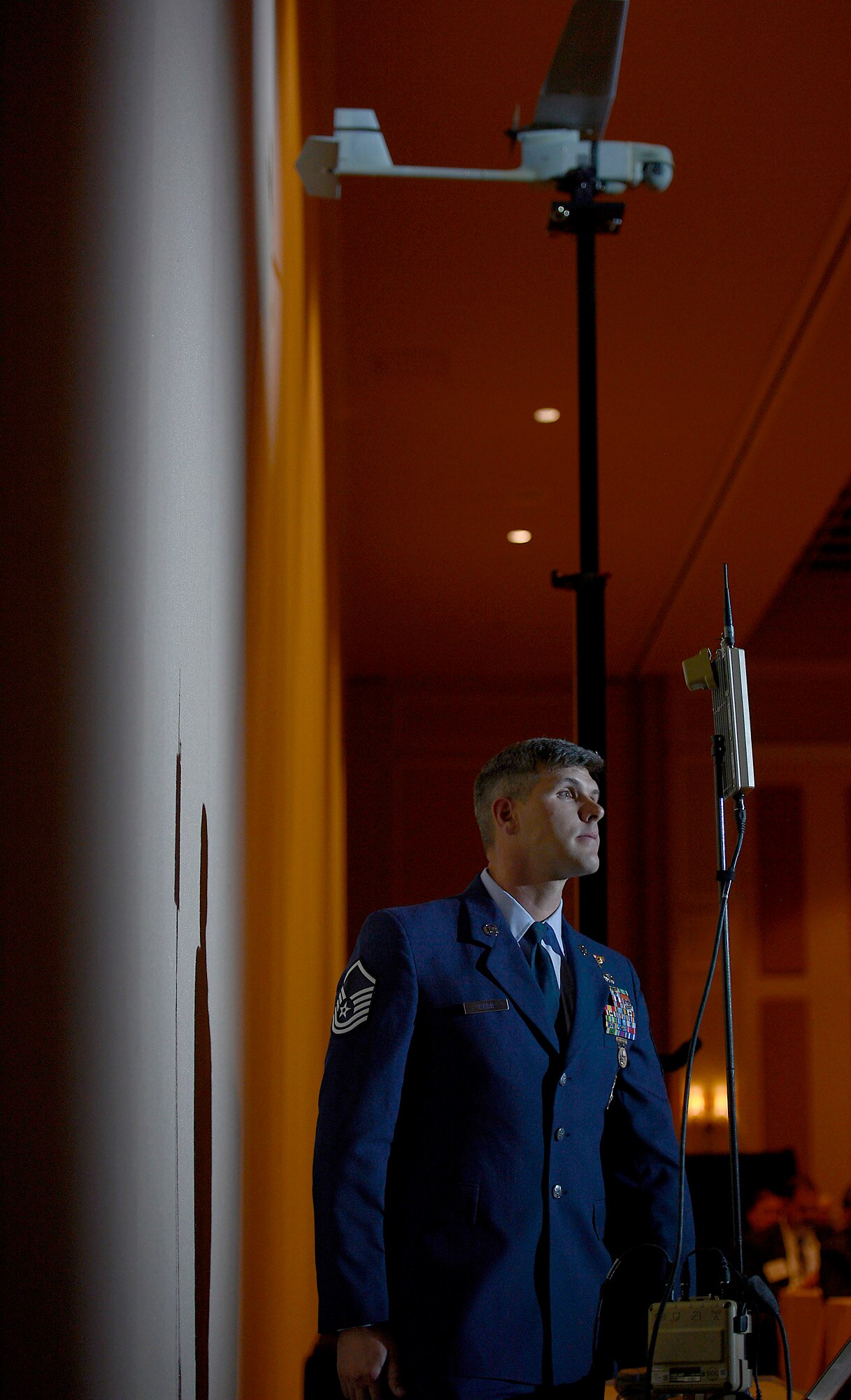 Master Sgt. Cory Hebb assists Secretary of the Air Force Deborah Lee James by demonstrating the RQ-11B Raven during her "State of the Force" keynote speech at the Air Force Association's annual Air Warfare Symposium and Technology Exposition Feb. 13, 2015, in Orlando, Fla. James spoke about not accepting further budget and force reductions. Hebb is assigned to the 820th Base Defense Group, 820th Combat Operations Squadron, at Moody Air Force Base, Ga. (U.S. Air Force photo/Scott M. Ash)