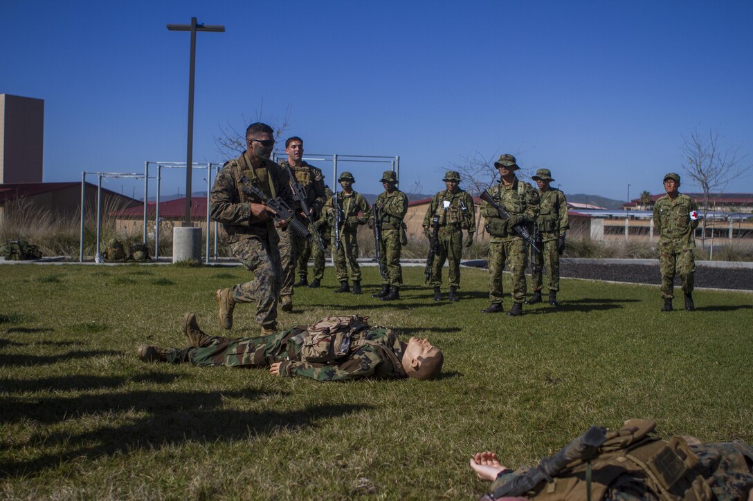Marines with 1st Reconnaissance Battalion demonstrate tactical combat casualty care on a training dummy, aboard Marine Corps Base Camp Pendleton, Calif., Feb. 10, 2015, during Exercise Iron Fist. Exercise Iron Fist is an annual bilateral training exercise between U.S. and Japanese military forces that builds their combined ability to conduct amphibious and land-based contingency operations. (Photo by Lcpl. Danielle Rodrigues/Released)