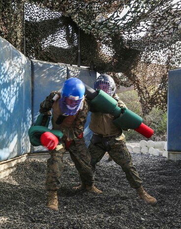 Recruits of Bravo Company, 1st Recruit Training Battalion, battle each other during Pugil Sticks III at Marine Corps Recruit Depot San Diego, Feb. 2. The pugil sticks resemble a weapon with a bayonet attachment, which recruits use to practice the techniques they have learned in previous classes.