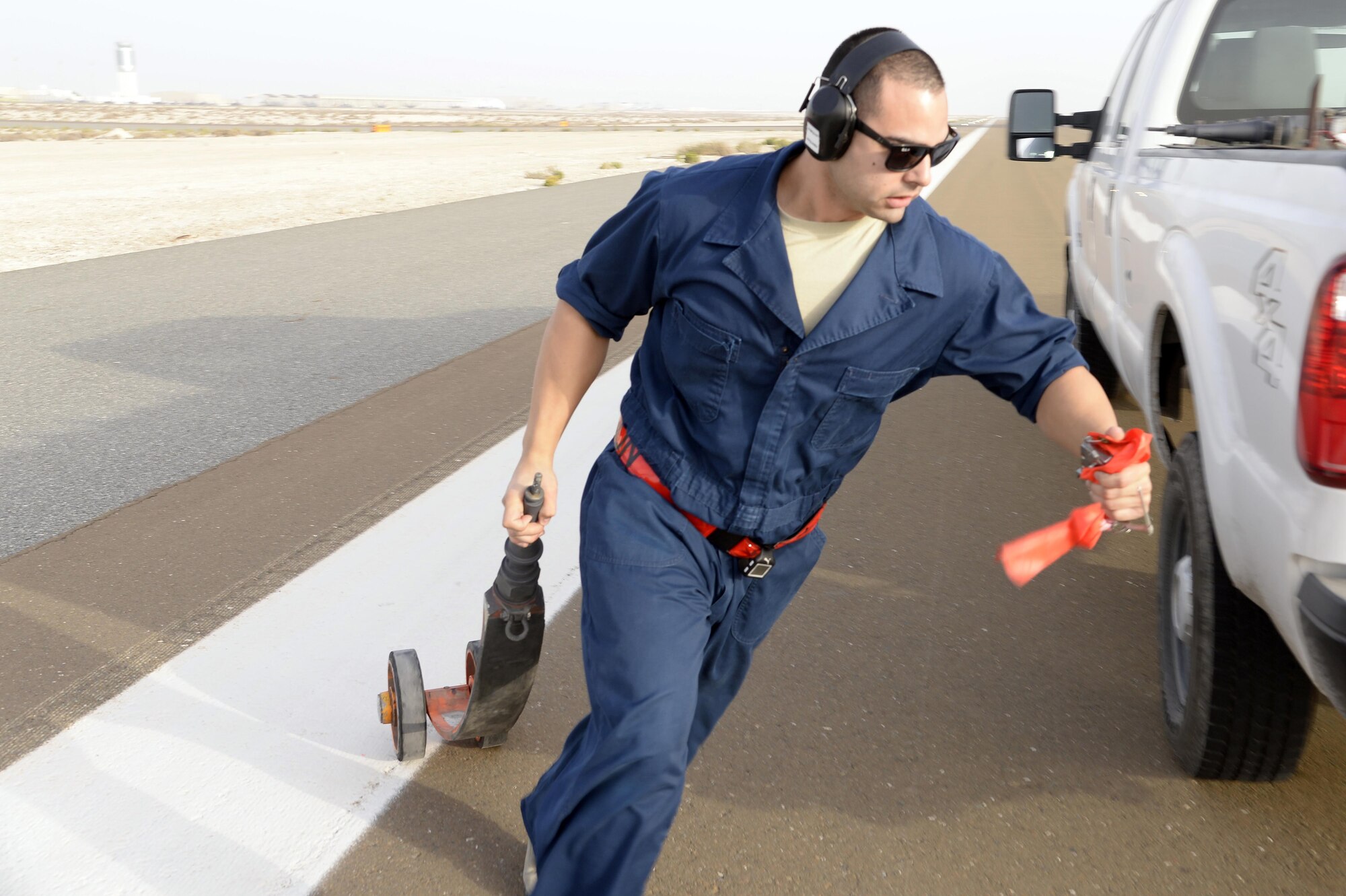 Staff Sgt. Ruben, Dragon Aircraft Maintenance Unit, prepares to install a pogo wheel on a U-2 Dragon Lady at an undisclosed location in Southwest Asia Feb. 9, 2015. These bicycle-type wheels are used to support the aircraft's extended wingspan during taxi for all takeoffs and landings. It’s the unique design that gives the U-2 its remarkable performance and makes flying very challenging. Ruben is currently deployed from Beale Air Force Base, Calif. (U.S. Air Force photo/Tech. Sgt. Marie Brown)