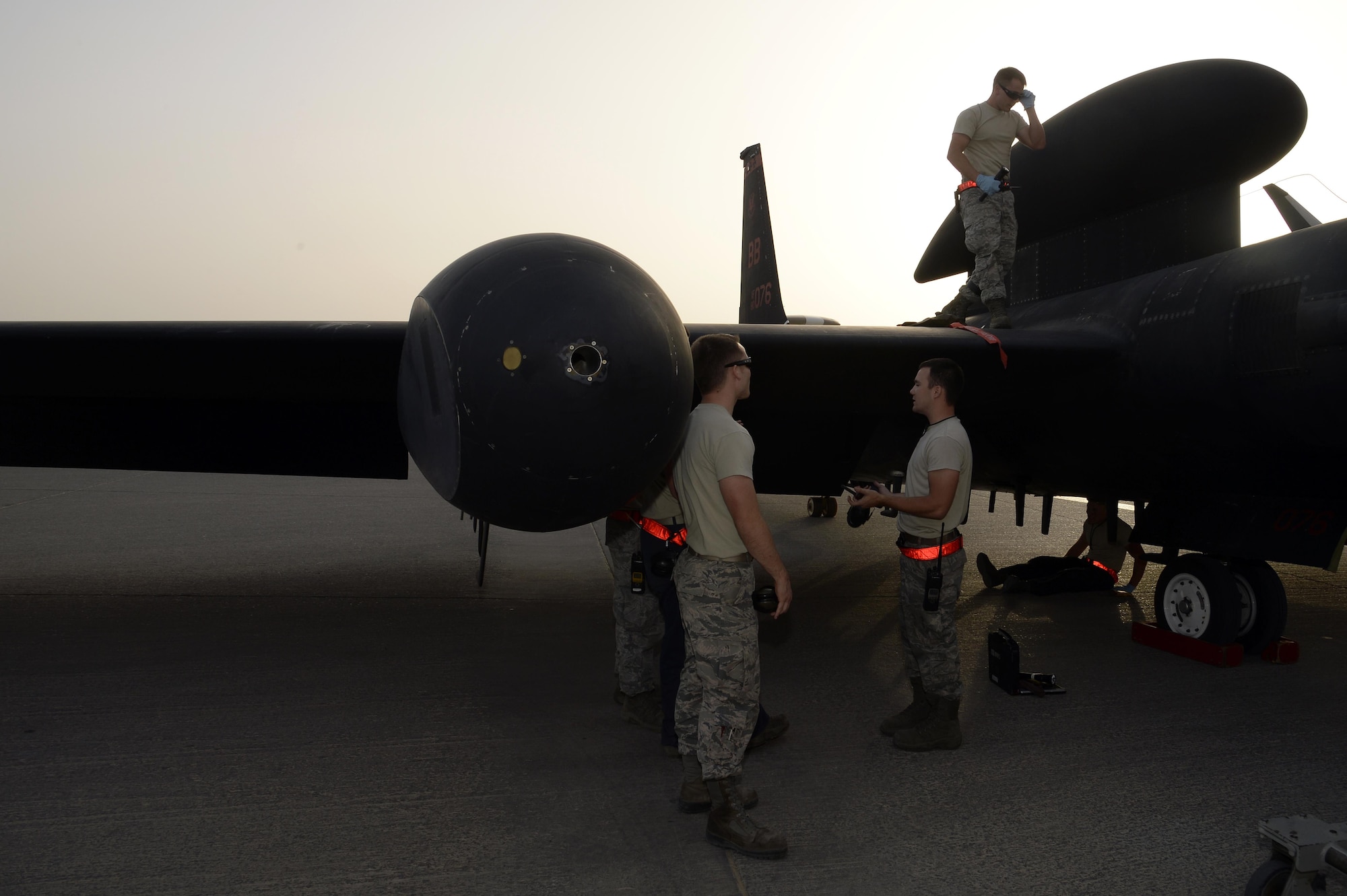 Airmen with the Dragon Aircraft Maintenance Unit gather around a U-2 Dragon Lady for a post-flight inspection at an undisclosed location in Southwest Asia Feb. 9, 2015. Everyone from crew chiefs to sheet metal will work together to make sure the plane can fly. (U.S. Air Force photo/Tech. Sgt. Marie Brown) 