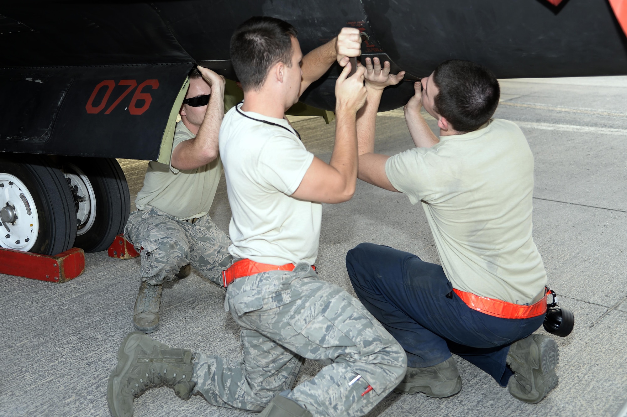 Airmen with the Dragon Aircraft Maintenance Unit work together to perform a post-flight inspection on a U-2 Dragon Lady at an undisclosed location in Southwest Asia Feb. 9, 2015. Whether it is crew chiefs, avionics or E&E technicians each Airman within the Dragon AMU plays a pivotal role in the overall mission. (U.S. Air Force photo/Tech. Sgt. Marie Brown)