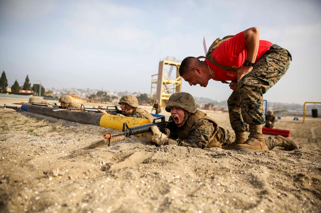 Recruits of Bravo Company, 1st Recruit Training Battalion, run through a bayonet assault course at Marine Corps Recruit Depot San Diego, Feb. 2. Sections of the exercise included tire stabbing, getting in and out of a trench and using commands to conduct a combat rush.