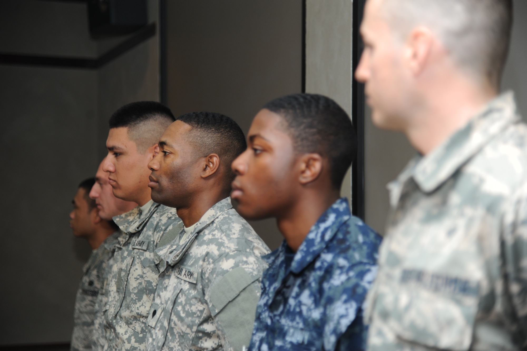 Six military members from different branches of service receive their U.S. citizenship during a U.S. Naturalization Ceremony, Feb. 11, 2015, at Stennis Hall, Keesler Air Force Base, Miss.  This was the first time Keesler hosted a naturalization ceremony.  (U.S. Air Force photo by Kemberly Groue)