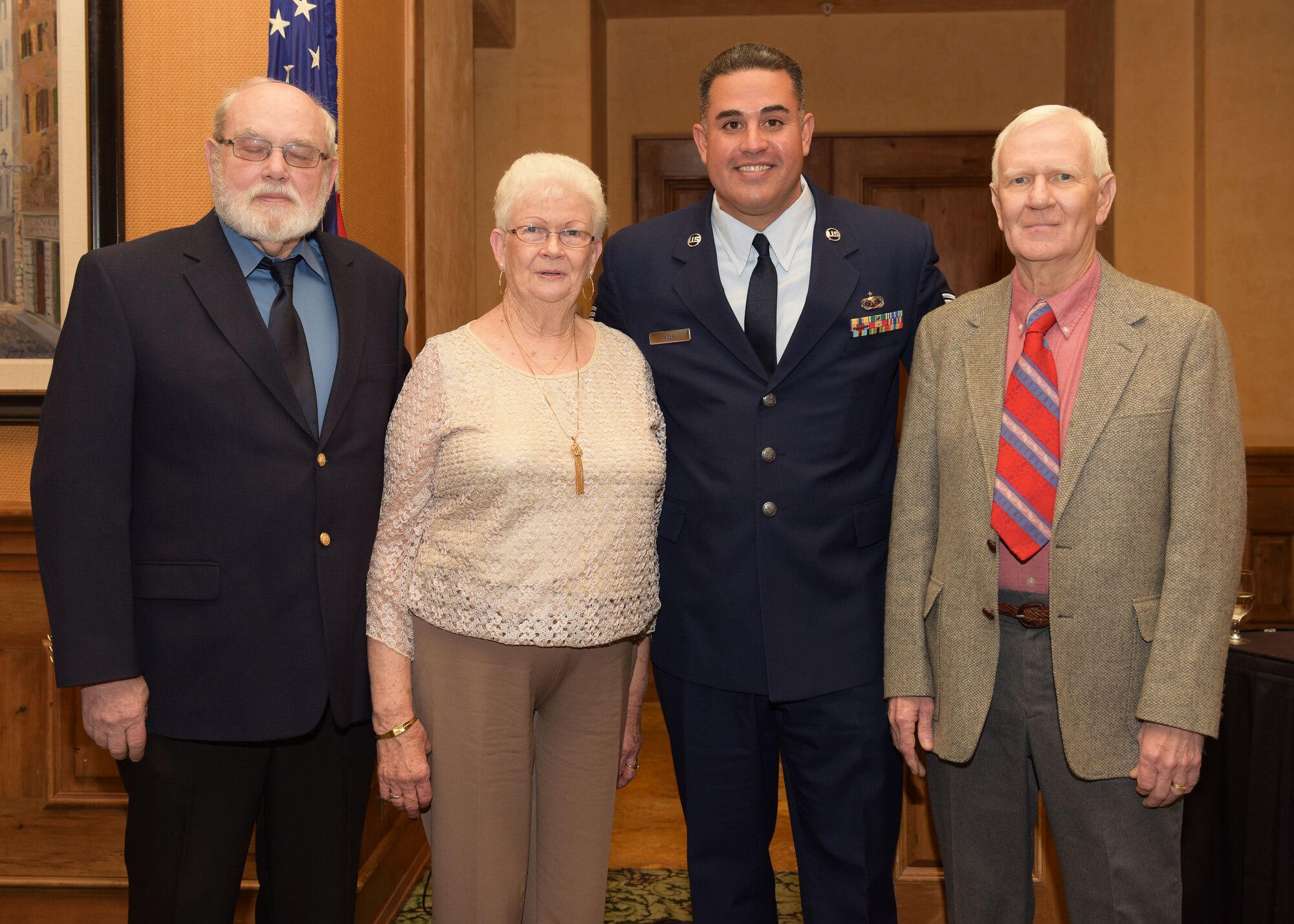 Tech. Sgt. Louis Vega Jr., poses with family members of the late Tech. Sgt. Graydon Williams, Feb 11 at the Pebble Creek Country Club, Goodyear, Ariz. From left to right: Harry Shappell, husband to Alma Shappell; Alma Shappell, sister of Graydon Williams; Tech. Sgt. Louis Vega Jr. and Neal Williams, brother of Graydon Williams. (U.S. Air Force photo by Staff Sgt. Lausanne Kinder)