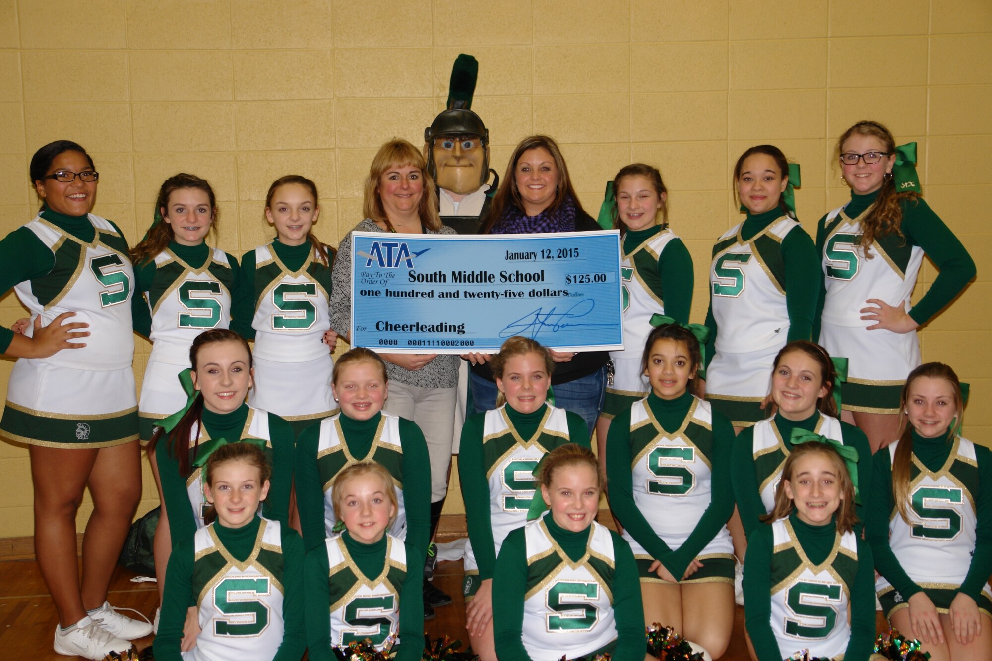 The cheerleading team at South Middle School receives a donation from the Aerospace Testing Alliance (ATA) Employee and Community Activities Committee (E&CAC) to help with uniform and equipment costs. Pictured back row, standing: Trinity Lewis, Carly Bean, Aleigh Sherril, Cheerleading Coach Tara Brewer, Brandon Landis (mascot), E&CAC representative Andrea Stevens, Madison Bagget, Alexis Mosley and LK Whitsett. Second row: Madyson Damron, Maddie Cunningham, Jenna Graves, Alexia Finch, Grace Palmertree and Kayleigh Hogan. Third row, seated: Hannah Daniel, Emma Elliott, Jada Graves and Kayla Henley. (Photo by Tina Lindsey)

