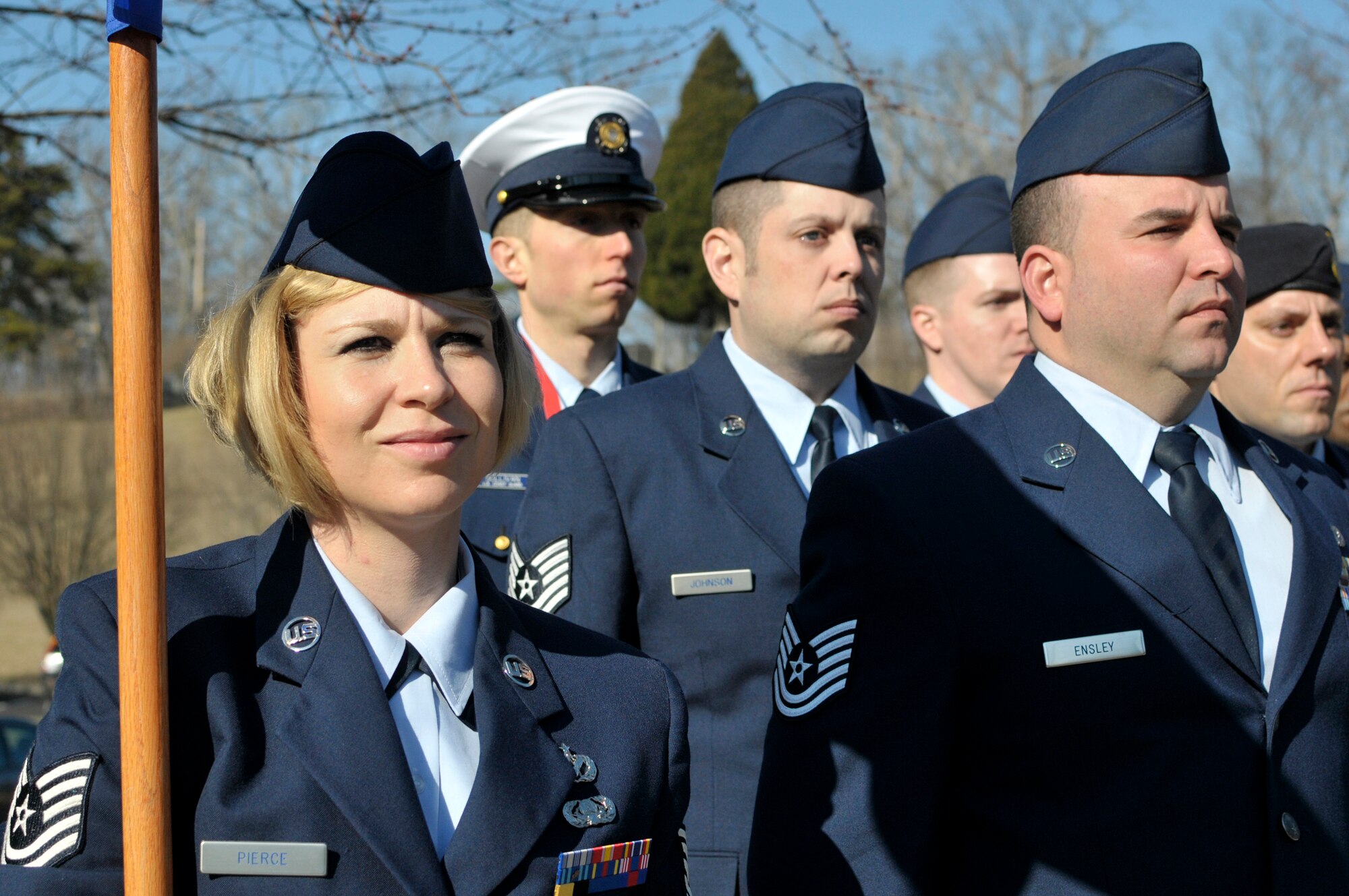 MCGHEE TYSON AIR NATIONAL GUARD BASE, Tenn. - Tech. Sgt. Abby Pierce, from the 139th Airlfit Wing, Missouri Air National Guard, holds the guidon for J-flight, during the graduation day retreat ceremony for NCO Academy and Airman Leadership School here, Feb. 12, 2015, at the I.G. Brown Training and Education Center. Pierce and Tech. Sgt. Gershon Raposo voluntered to sing the National Anthem for their class's ceremony. (U.S. Air National Guard photo by Master Sgt. Mike R. Smith/Released)
