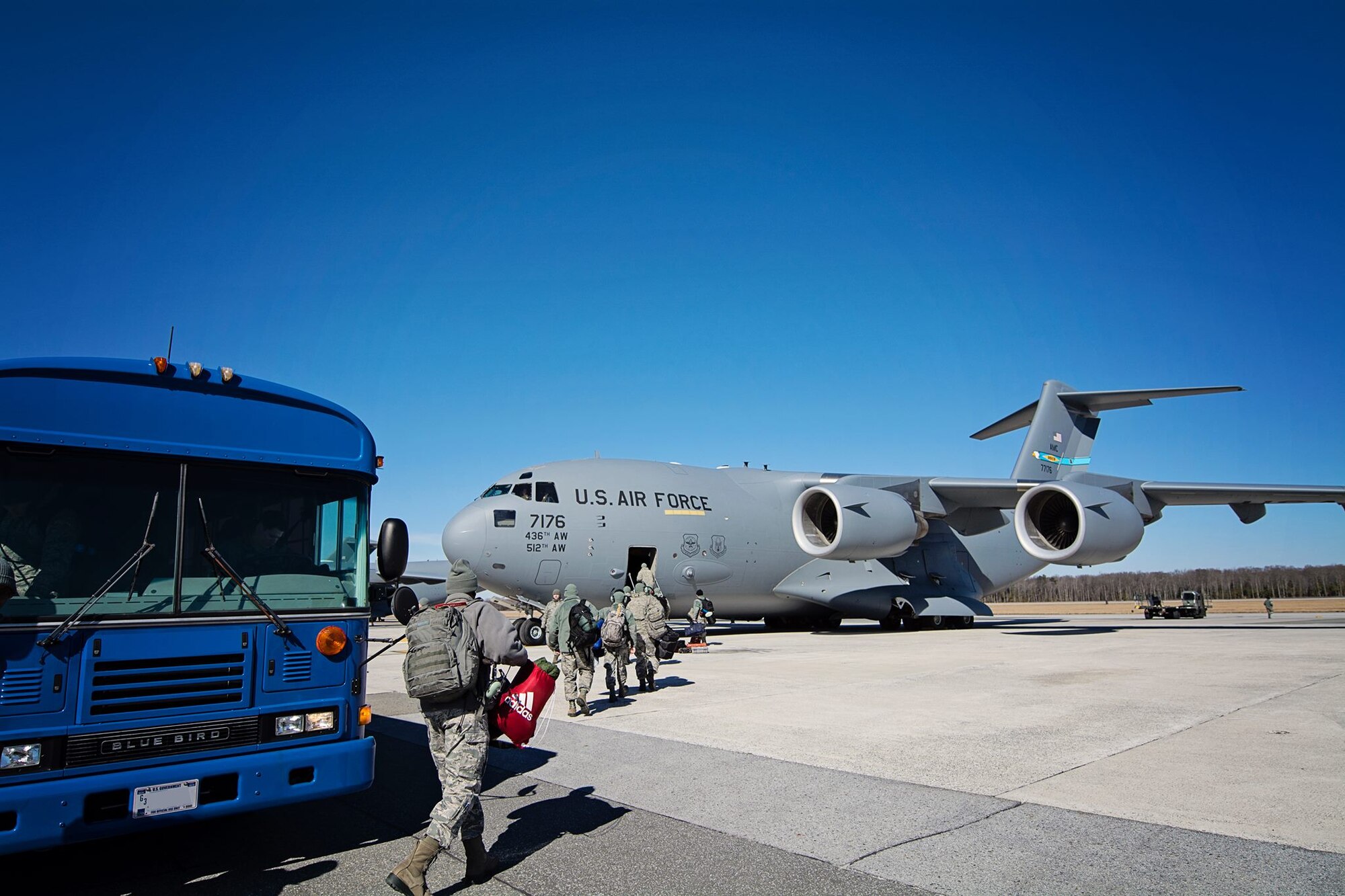 Nearly 20 512th Maintenance Group reservists board a C-17 Globemaster III on Dover Air Force Base, Del., Feb. 13, 2015. The team is headed to Germany, where they will train and assist in aircraft maintenance for two weeks in the European Command. (U.S. Air Force photo/Capt. Bernie Kale)