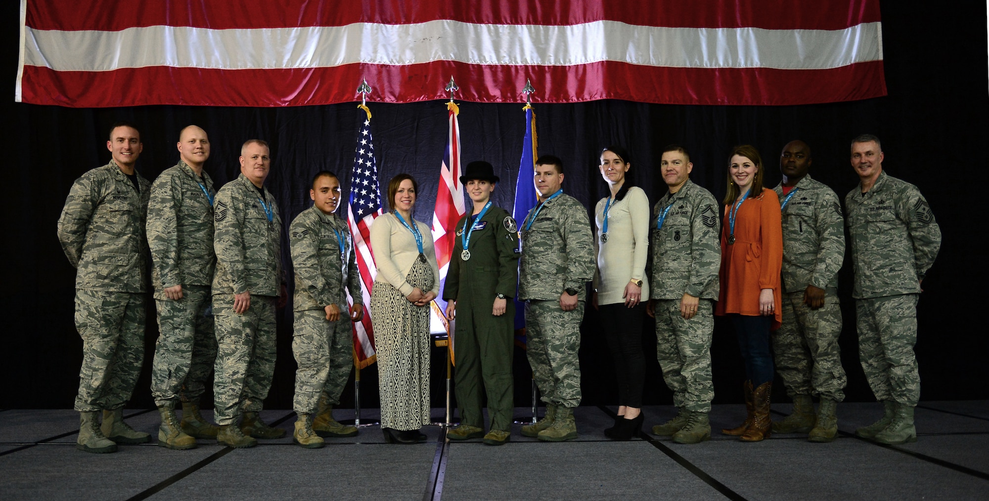 The 48th Liberty Wing’s top performers were recognized by Col. Robert Novotny, 48th FW commander (far left), and Chief Master Sgt. Vincent Marler, 48th FW command chief (far right), during the 2014 Annual Awards Banquet at Royal Air Force Lakenheath, England, Feb. 13, 2015. Airmen were recognized across 11 categories, representing the spectrum of the 48th Fighter Wing. The award winners will go on to compete in the U.S. Air Forces in Europe annual awards. (U.S. Air Force photo by Airman 1st Class Erin R. Babis)