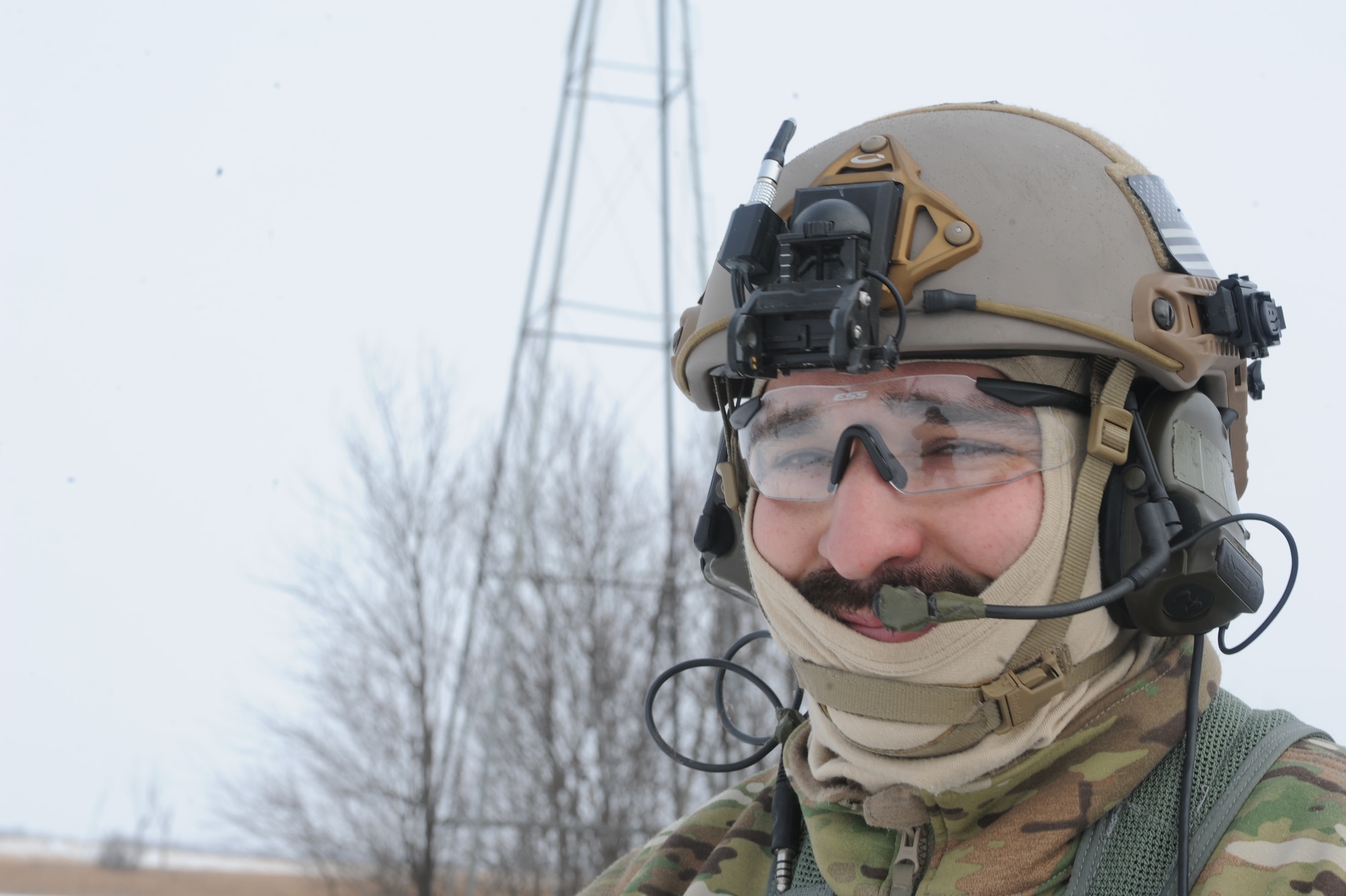 Tech. Sgt. Thomas Liscomb, 54th Helicopter Squadron flight engineer, smiles during a search and rescue training mission near Minot Air Force Base, N.D., Feb. 11, 2015. During the training, Liscomb and the rest of a UH1-N helicopter crew practiced extracting individuals using a force penetrator. (U.S. Air Force photos/Senior Airman Stephanie Morris)