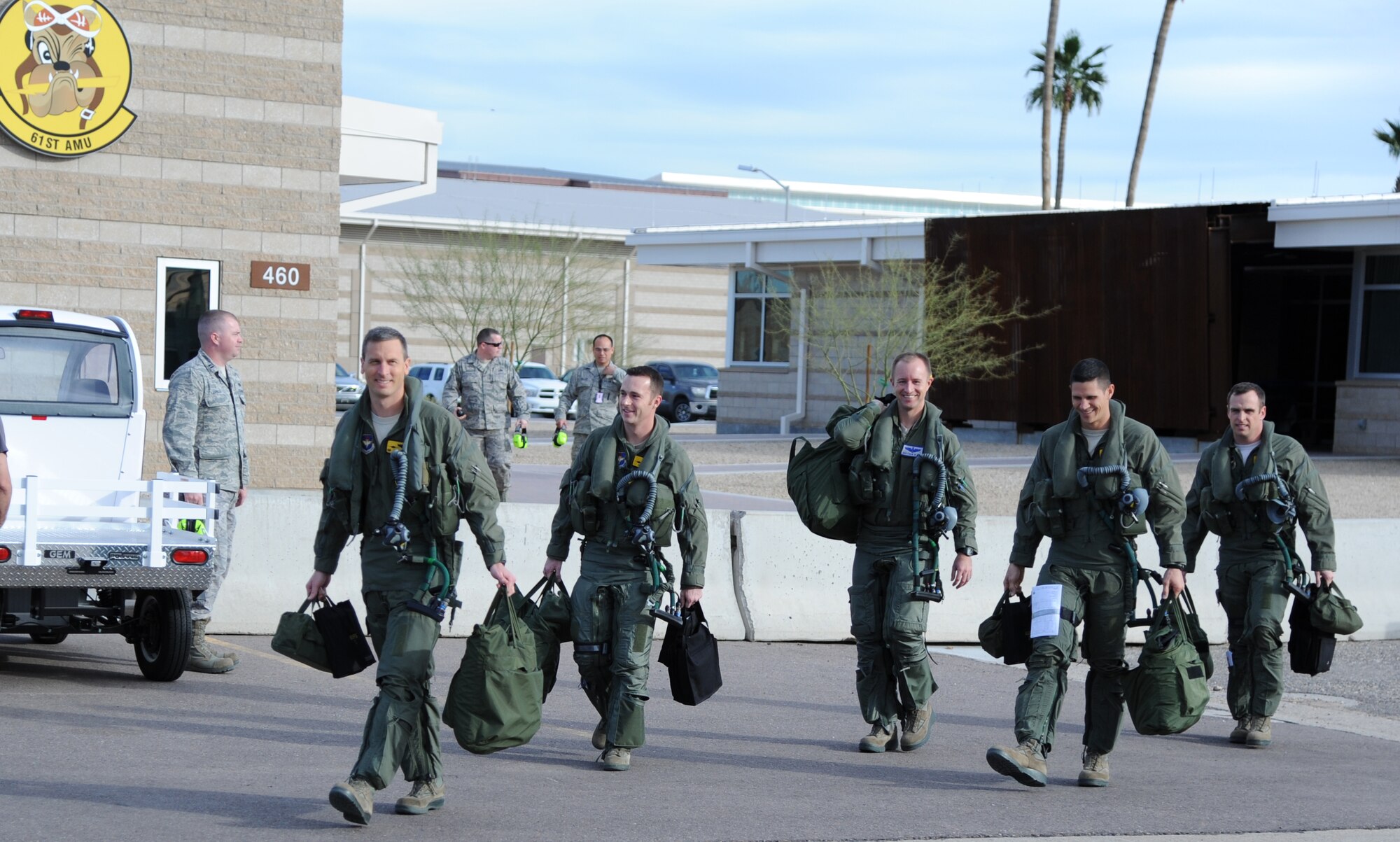 ROM LEFT: Lt. Col. Michael Ebner, 61st Fighter Squadron commander, Maj. Joshua Arki, 61st FS, Maj. Matthew Olson, 56th Operations Group, and Maj. John Wilson, 61st FS assistant director of operations, and Lt. Col. Gregory Frana, 61st FS director of operations, make their way to the flightline Jan. 25 as they prepare for the first-ever F-35 Lightning II joint strike fighter flyover at the 2015 Pro Bowl played at the University of Phoenix Stadium. The flight was precision timed for the four-ship formation to fly over the open roof of the stadium as Jordan Sparks sang the final words to the national anthem. 
 (U.S. Air Force photo/Staff Sgt. Luther Mitchell Jr.)