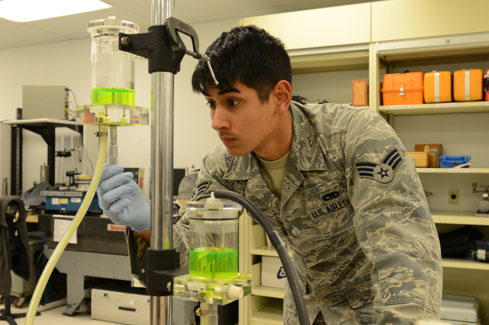 Senior Airman Donald Area, 56th Component Maintenance Squadron precision measurement equipment laboratory journeyman, works on an environmental control test set Feb. 3 in Bldg. 417 at Luke Air Force Base. The environmental control test set assesses the temperature, pressure, general well-being and integrity of the F-16 Fighting Falcon. (U.S. Air Force photo/Senior Airman James Hensley)
