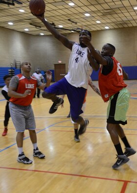 Eric Gist, 56th Medical Support Squadron, drives in for a layup Feb. 3 during the intramural basketball championship game against the 56th Civil Engineer Squadron at Luke Air Force Base. MDG defeated CE 42-40. (U.S. Air Force photo/Senior Airman Devante Williams)