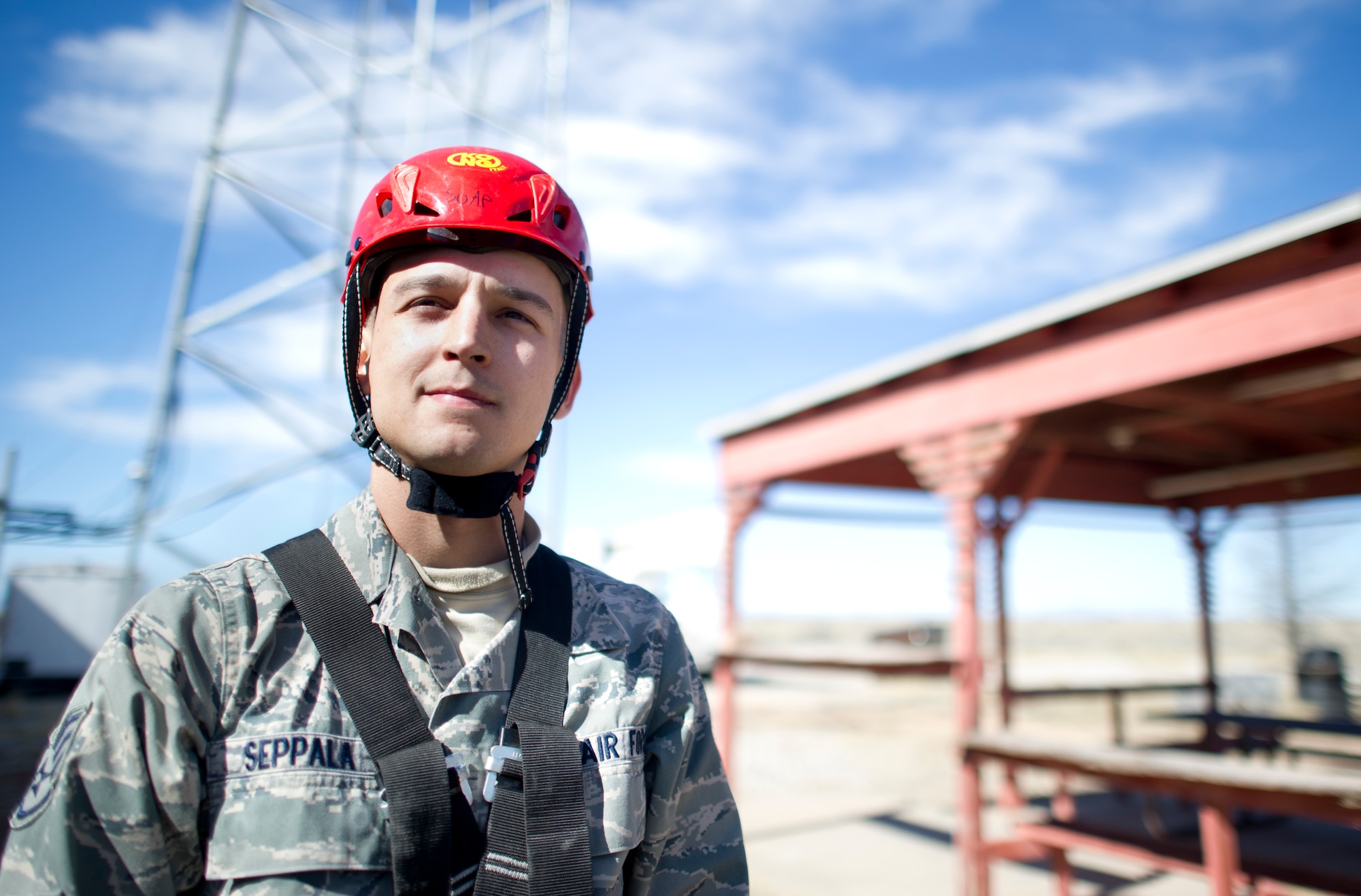 Staff Sgt. Ivan Seppala, 49th Communications Squadron Radio Frequency Transmissions Systems journeyman, prepares to demonstrate how to properly climb a tower Feb. 4, 2015 at Holloman Air Force Base, N.M. The Tower Climbing program is open to anyone interested in participating. (U.S. Air Force photo by Staff Sgt. Stacy Moless/Released)