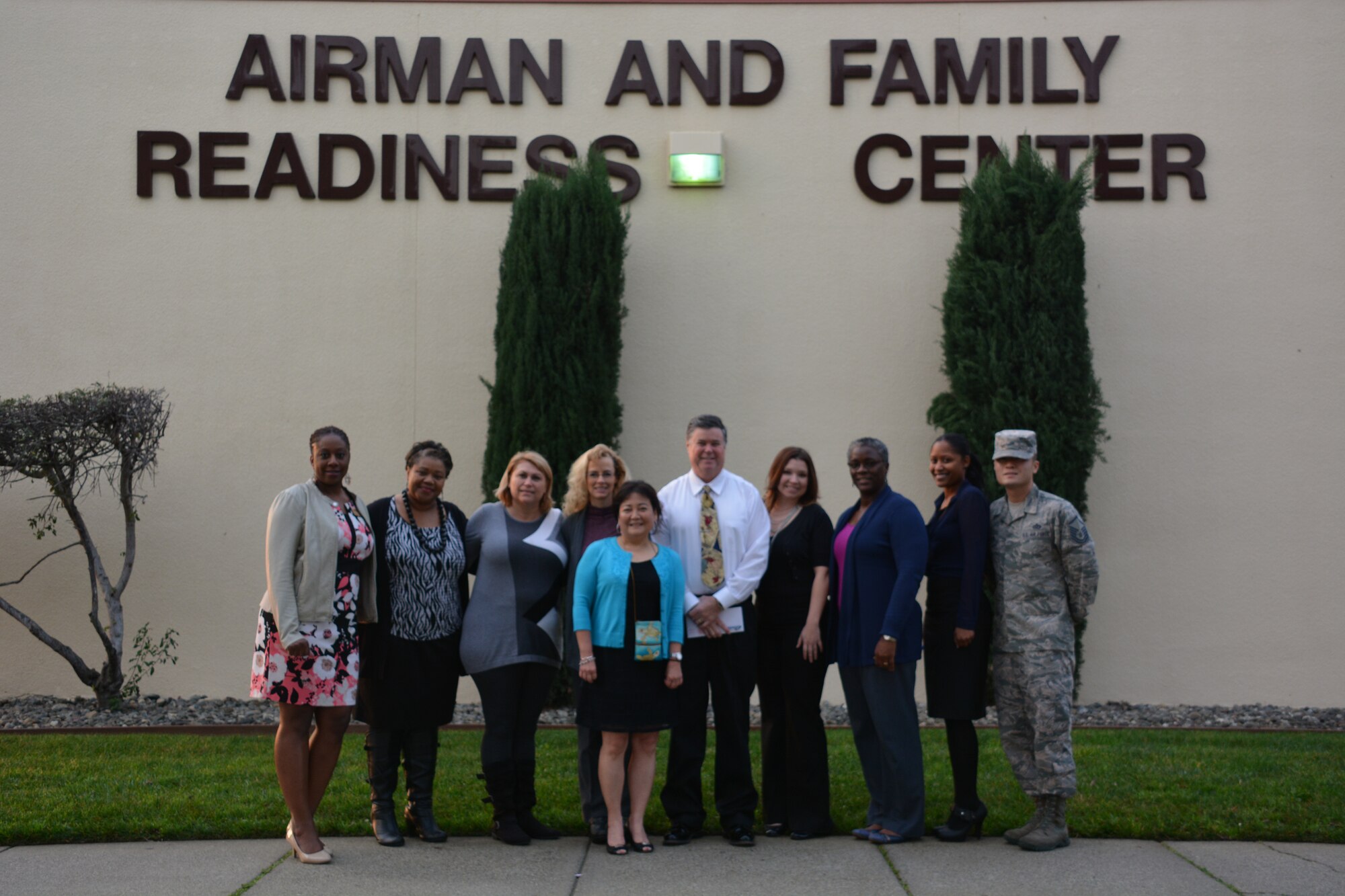 The Airman and Family Readiness Center team at Travis Air Force Base, Calif., takes a group photo outside Feb. 3 at the A&FRC at Travis. The team was recognized by Air Mobility Command for its selfless dedication and service it provides to service members and their families. (U.S. Air Force photo by Staff Sgt. Christopher Carranza)