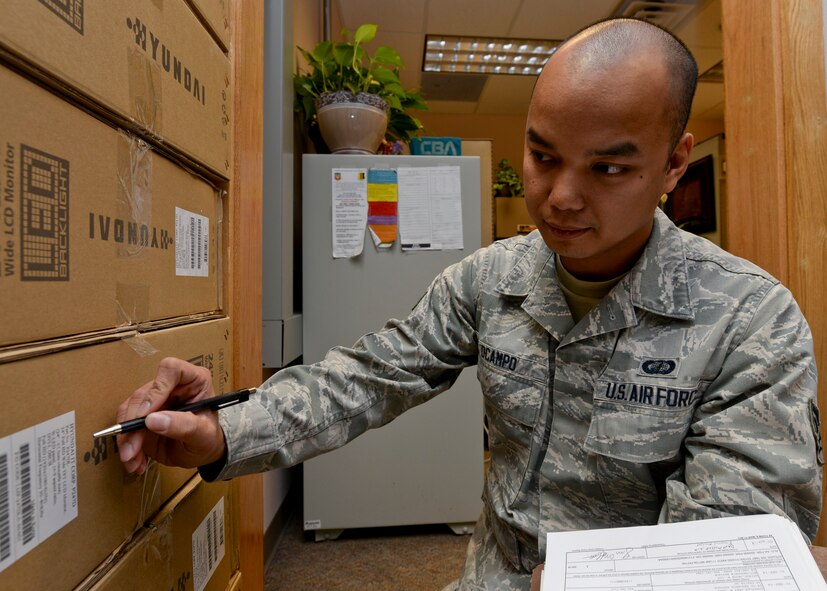 Senior Airman Robert Ocampo, 28th Contracting Squadron contract administrator, conducts product inventory at the 28th CONS office at Ellsworth Air Force Base, S.D., Jan. 22, 2015. For fiscal year 2014, the 28th CONS completed 500 contracting actions valued at over $32 million and was recognized as Air Combat Command’s “2014 Air Force Productivity Excellence Award” nominee. (U.S. Air Force photo by Senior Airman Anania Tekurio/Released)