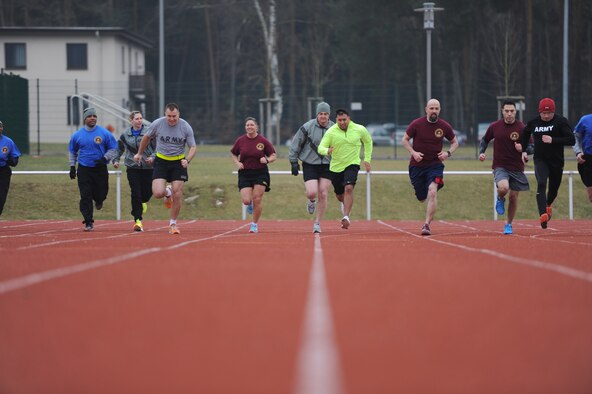 Participants compete during the 1,500-meter run of the European Regional Warrior Games time trials on Rhine-Ordnance Barracks, Germany, Feb. 12, 2015. Wounded warriors from Baumholder, Kaiserslautern, Wiesbaden, Stuttgart, Vilseck and Grafenwoehr came out to compete in the events. (U.S. Air Force Photo/Airman 1st Class Michael Stuart)