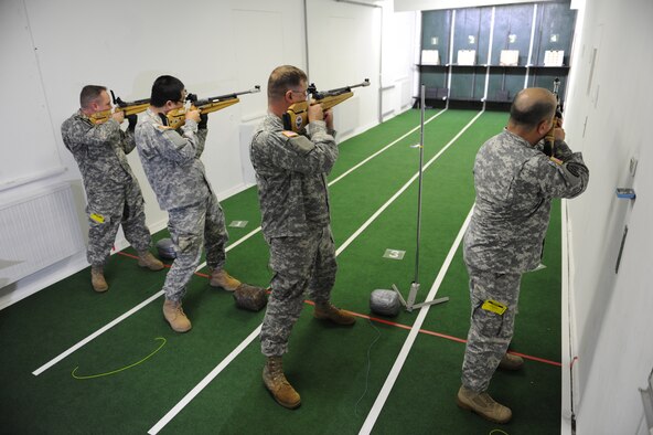 Participants compete in the air rifle portion of the European Regional Warrior Games time trials on Vogelweh Air Base, Germany, Feb. 12, 2015. The time trials is a competition to see how warriors stack up against their fellow brothers-in-arms on the track and field. (U.S. Air Force Photo/Airman 1st Class Michael Stuart) 