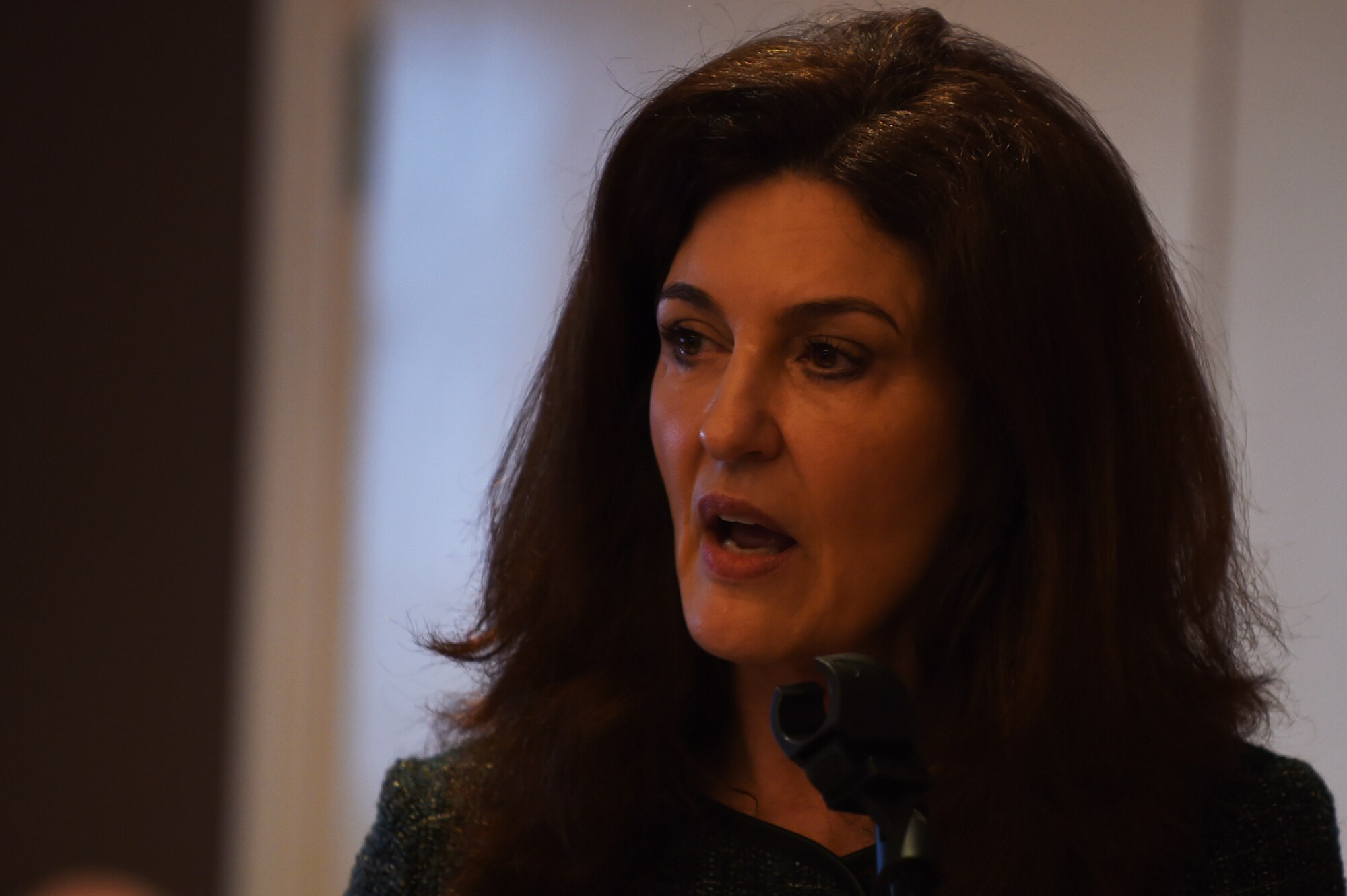 Kathleen O’Hara, a psychotherapist specializing in working with survivors of violent tragedies, speaks on her own experience with overcoming the pain of loss during the 2015 Annual 422nd Air Base Group National Prayer Breakfast at RAF Croughton, Feb. 13, 2015. O’Hara lost her son, Aaron Land, during a robbery, turned kidnapping, which ended in murder, May 31, 1999. (U.S. Air Force photo by Staff Sgt. Jarad A. Denton/Released)