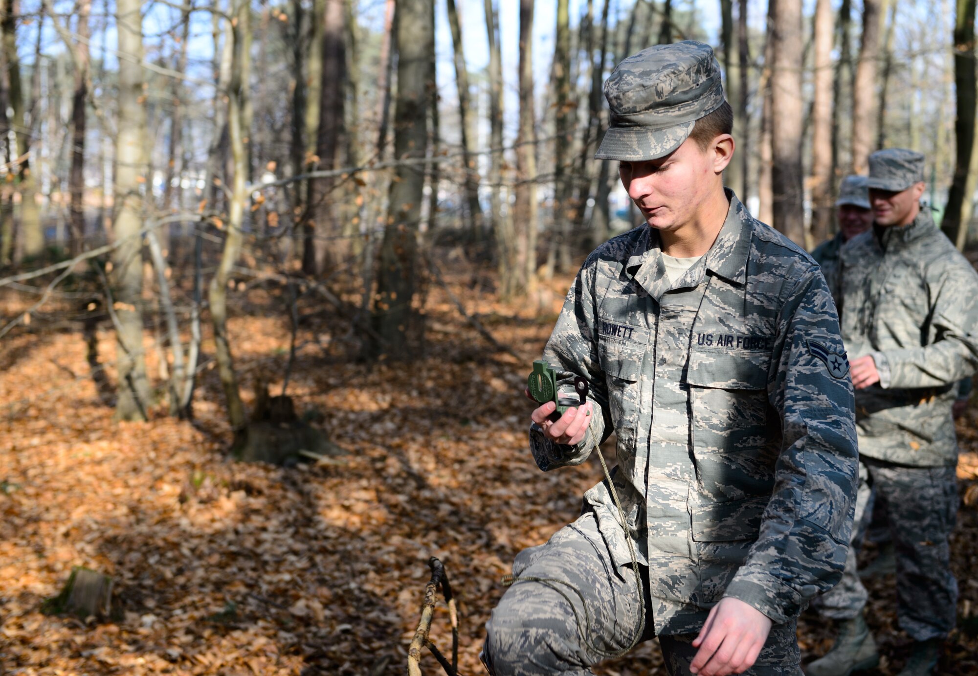 Airman 1st Class Alexander Rowett, 786th Civil Engineer Squadron heating, ventilation and air conditioning journeyman, follows his compass during a land navigation course at Ramstein Air Base, Germany, Feb. 12, 2014. The course was taught by a team of explosive ordnance disposal and engineer technicians. (U.S. Air Force photo/Senior Airman Armando A. Schwier-Morales) 