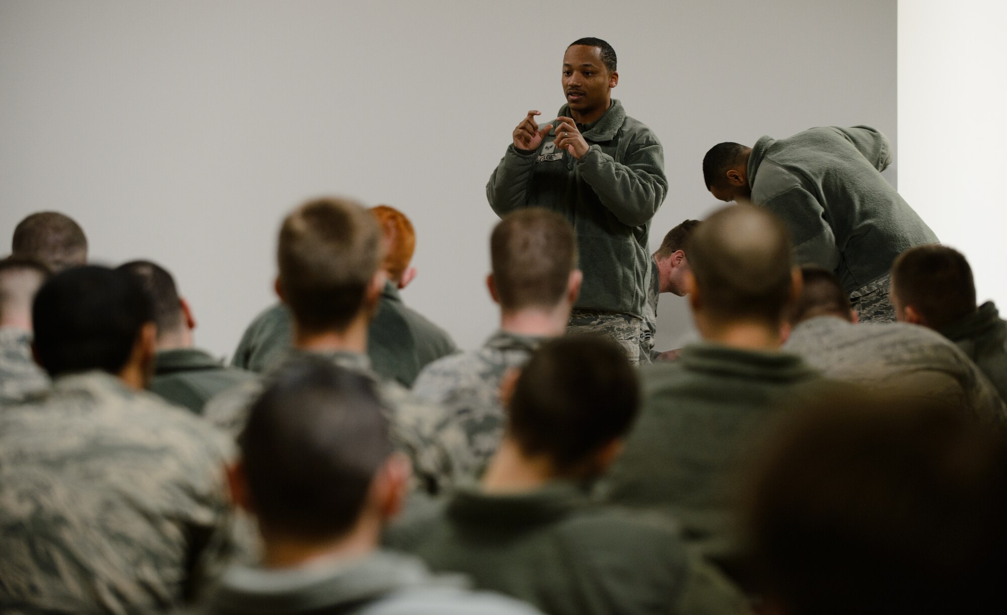 Senior Airman Raymond Cage, 86th Civil Engineer Squadron instructor, shows fellow Airmen proper use of a compass at Ramstein Air Base, Germany, Feb. 12, 2015. The engineer technician and explosive ordnance disposal Airmen trained other engineers on land navigation during their training day. (U.S. Air Force photo/Senior Airman Armando A. Schwier-Morales) 