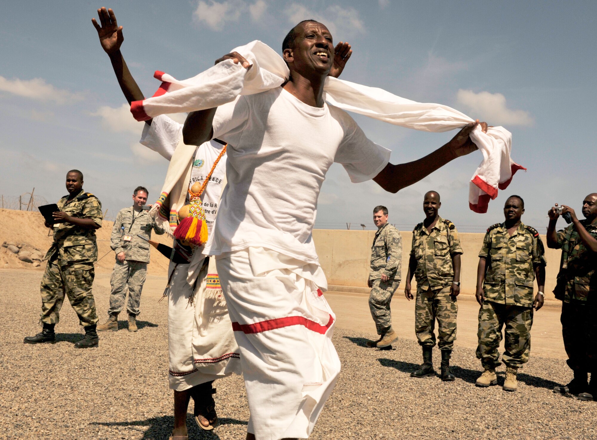 A Djiboutian air force member performs a traditional dance as part of a cultural exchange during African Partnership Flight???Djibouti at Djibouti Air Base, Feb. 9, 2015. African Partnership Flight is the premiere program to bring together partner nations to increase cooperation and interoperability, which fosters stability and security throughout the continent. (U.S. Air Force Photo by Tech. Sgt. Ian Dean)Base, Feb. 9, 2015.  African Partnership Flight is the premiere program to bring together partner nations to increase cooperation and interoperability, which fosters stability and security throughout the continent. (U.S. Air Force Photo by Tech. Sgt. Ian Dean)
