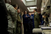 Deputy Secretary of Defense Bob Work speaks with a missileer from the 742d Missile Squadron at a missile alert facility in North Dakota, Feb. 11, 2015. During his visit to Minot Air Force Base, N.D., Work also received tours of the weapons storage area, a B-52H Stratofortress and Uniform-01.  (U.S. Air Force photo/Senior Airman Brittany Y. Bateman)