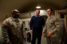 Staff Sgt. Joshua Gibson, 742d Missile Squadron alert facility manager, gives Deputy Secretary of Defense Bob Work and Command Sgt. Maj. Patrick Alston, senior enlisted leader for the United States Strategic Command, Offutt Air Force Base, Neb., a tour of a missile alert facility in North Dakota, Feb. 11, 2015. During their visit to Minot Air Force Base, N.D., they also received tours of the weapons storage area, a B-52H Stratofortress and Uniform-01. (U.S. Air Force photo/Senior Airman Brittany Y. Bateman)