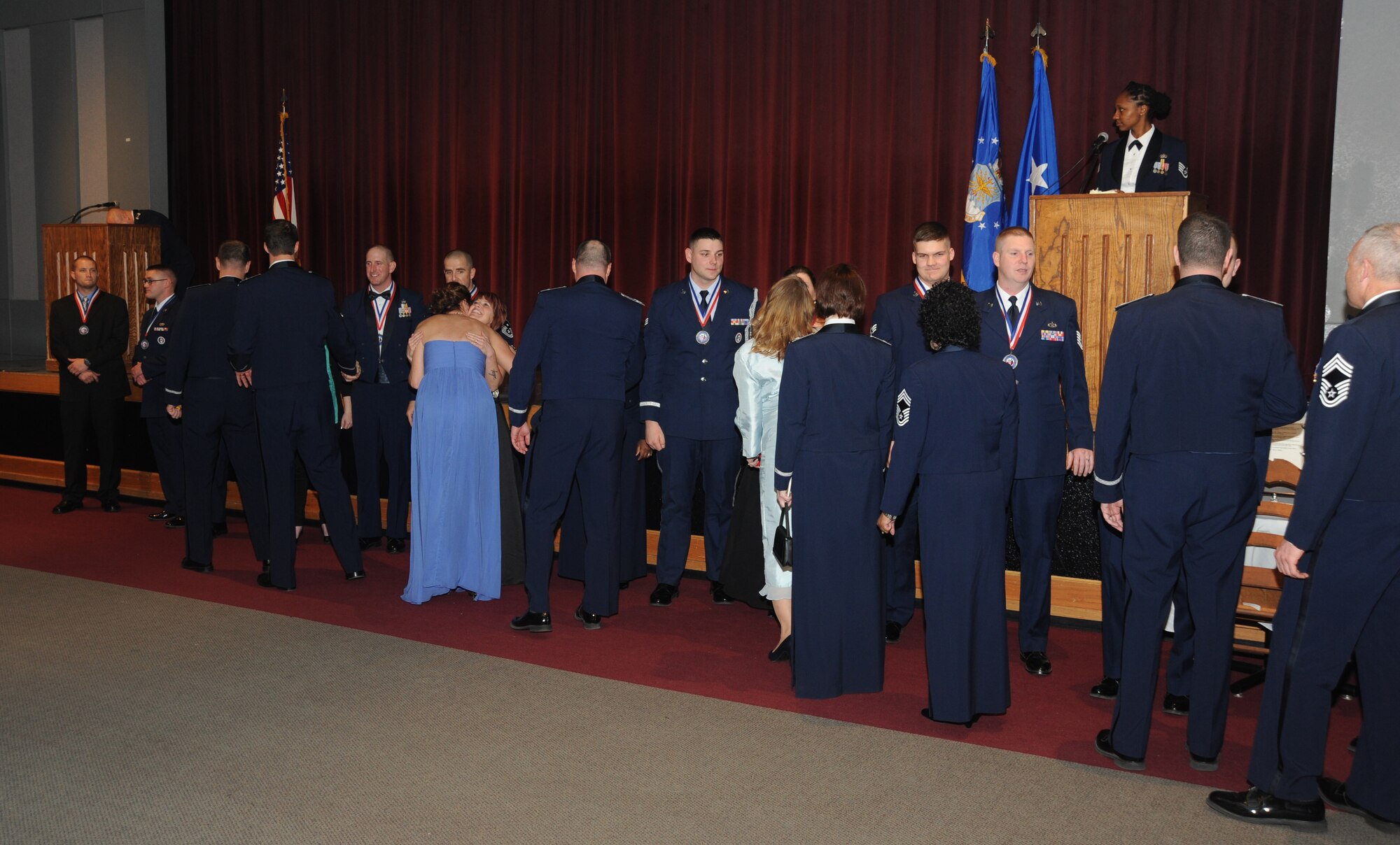 Members of Team Whiteman gather to congratulate the 2014 Annual Award winners at Warrensburg, Mo. Feb. 6, 2015. Military as well civilian members of Team Whiteman were recognized for exceptional performance throughout the year. (U.S. Air Force photo by Airman 1st Class Jovan Banks/Released)