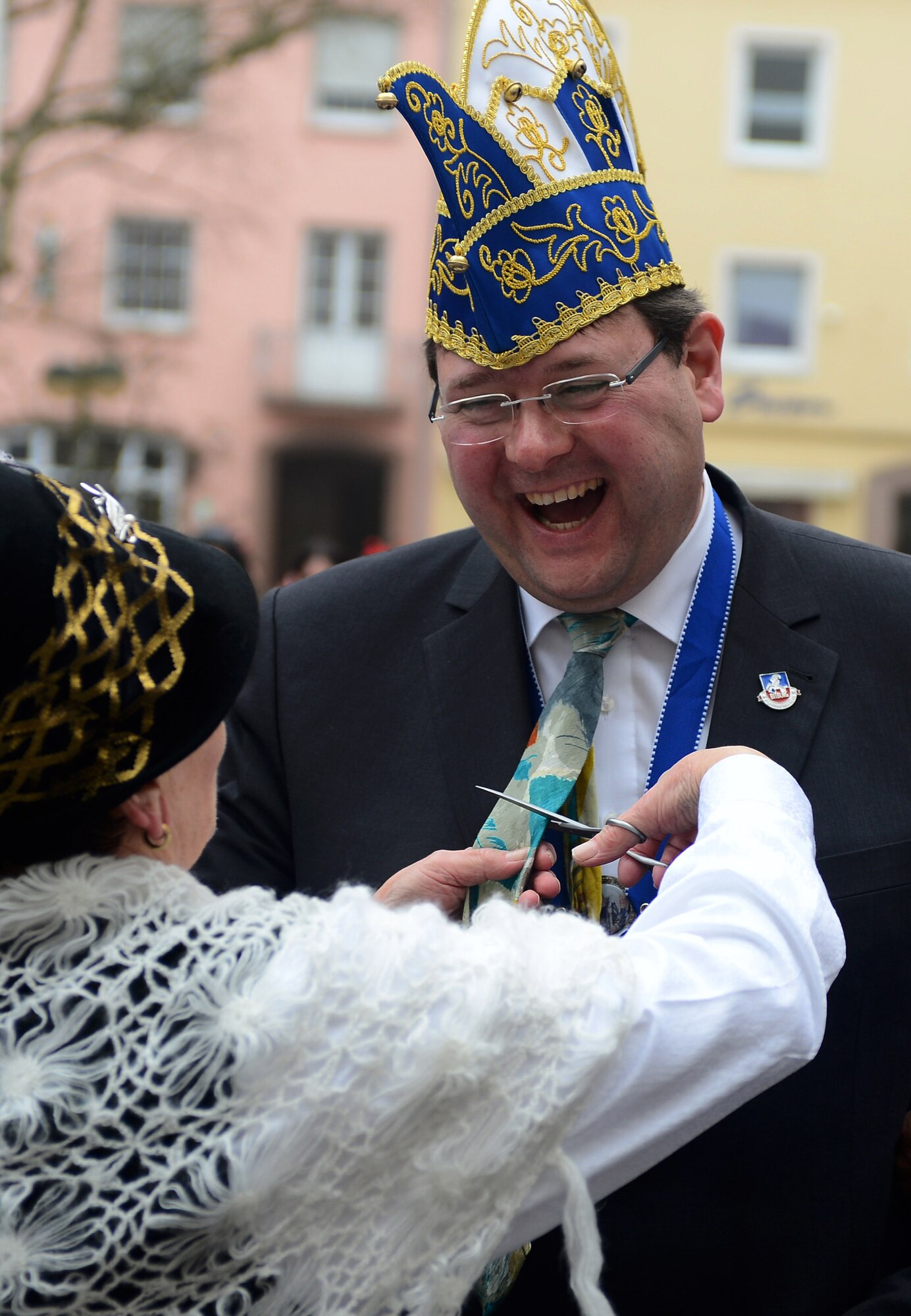Joachim Kandels, Bitburg mayor, gets his tie cut off during the 2015 Storming of the Rathaus Fasching event in Bitburg, Germany, Feb. 12, 2015. A woman cutting off a man’s tie is a longtime tradition observed during Fasching. (U.S. Air Force photo by Airman 1st Class Luke Kitterman/Released)
 
