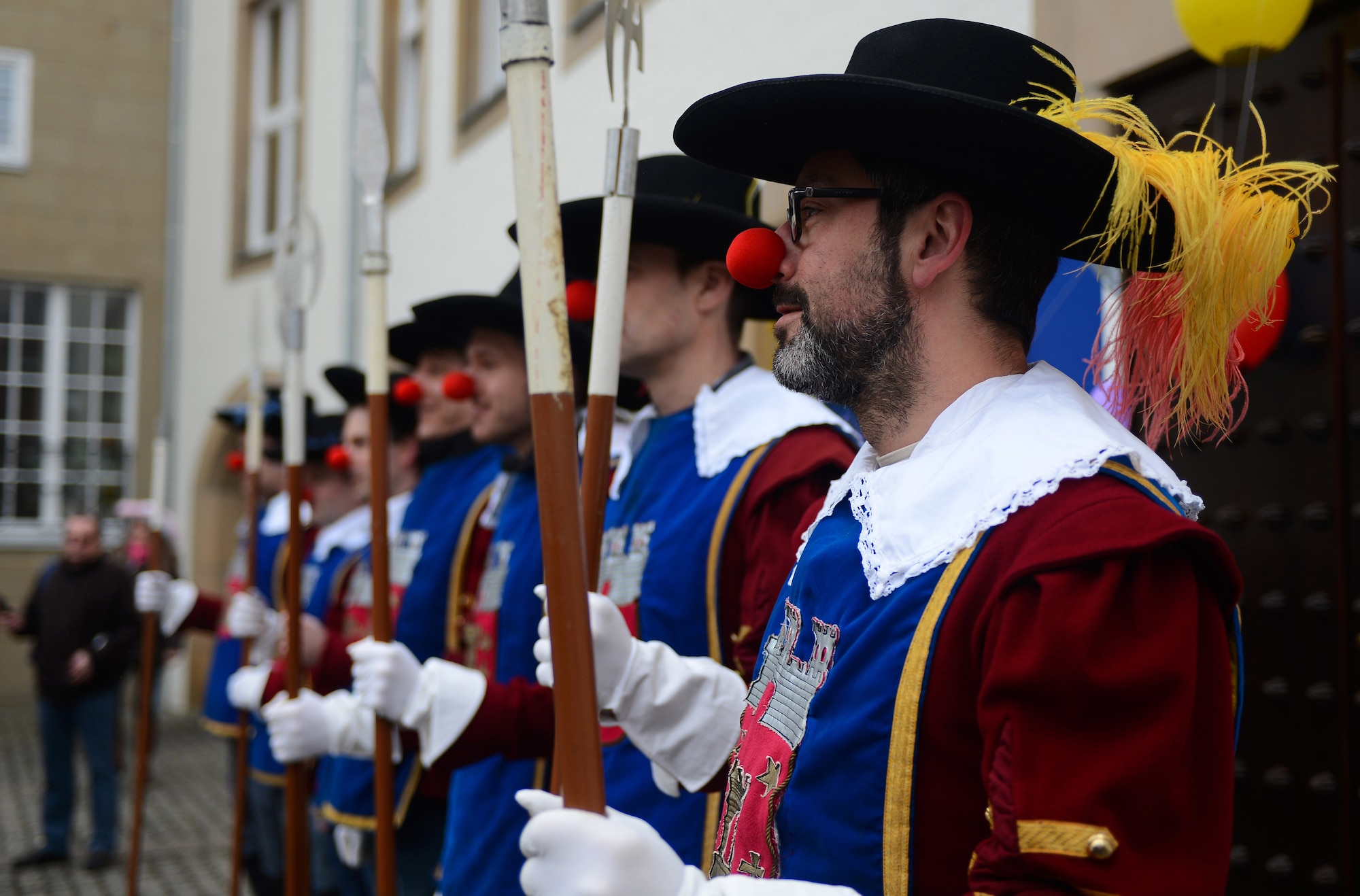 Male citizens of Bitburg stand guard in the city square during the 2015 Storming of the Rathaus Fasching event in Bitburg, Germany, Feb. 12, 2015. The men guarded the city as the women of Bitburg try to take it over as part of the holiday’s local tradition. (U.S. Air Force photo by Airman 1st Class Luke Kitterman/Released)